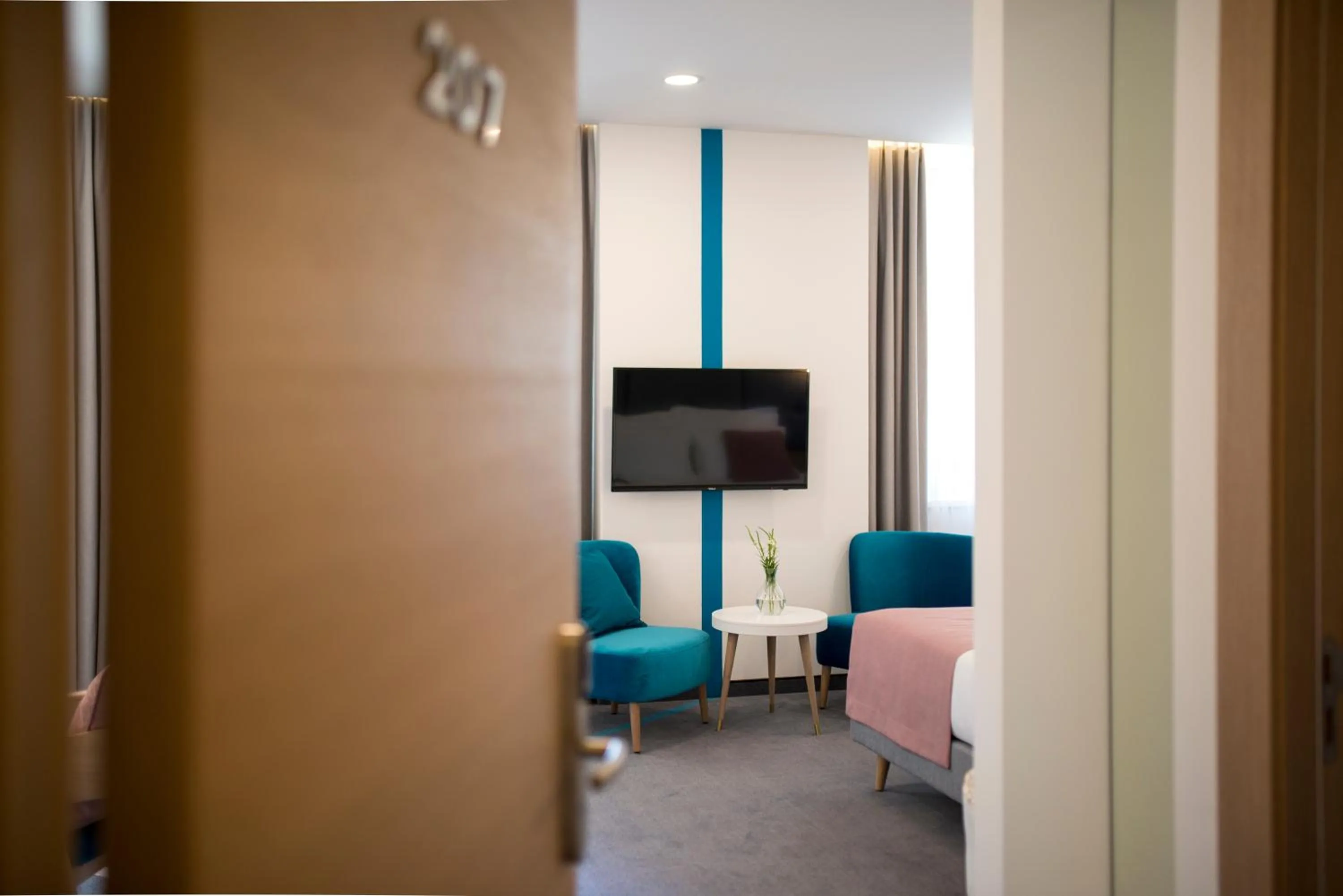 Bed in City Nest Modern & Cozy Suites