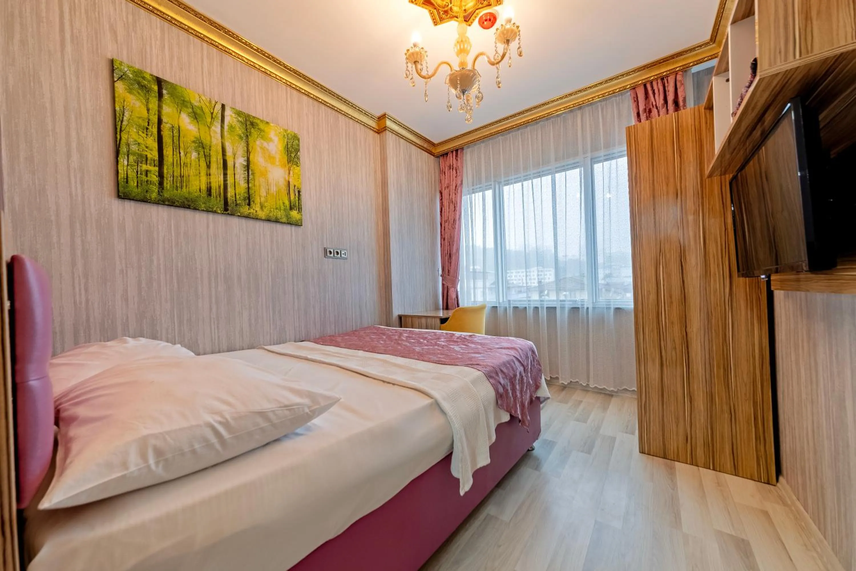 Bed in Royal Babil Suites Hotel