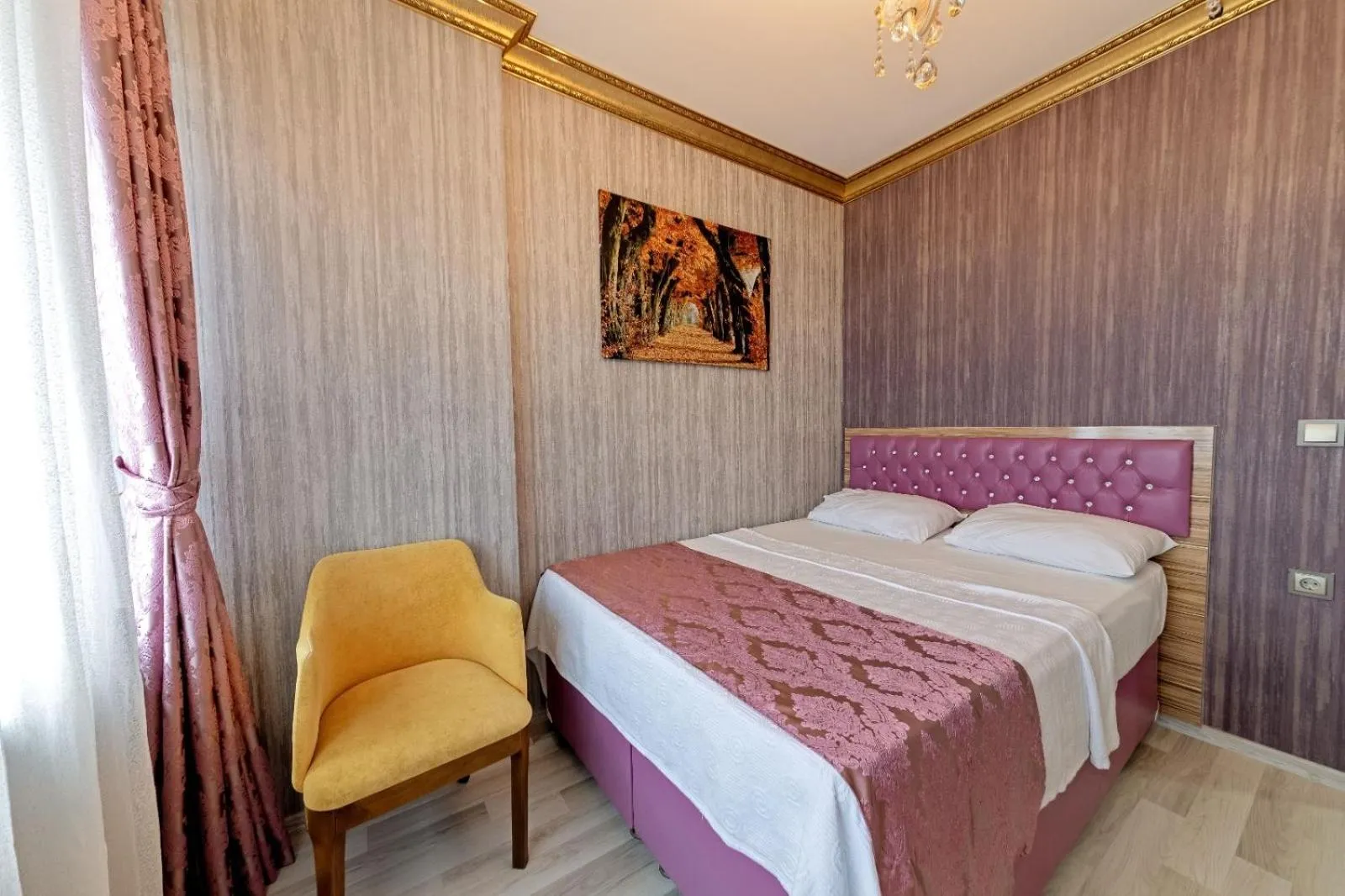 Bed in Royal Babil Suites Hotel