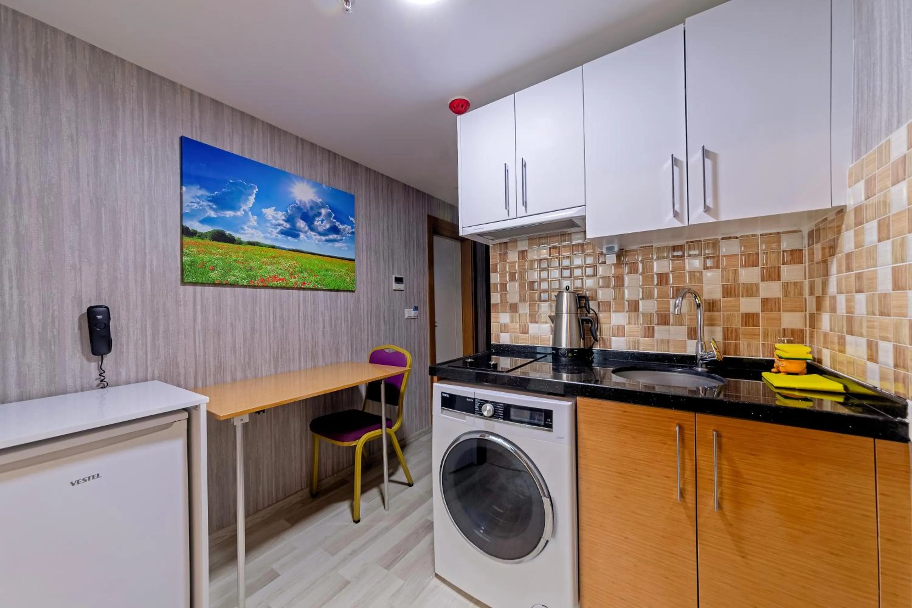 Kitchen or kitchenette in Royal Babil Suites Hotel