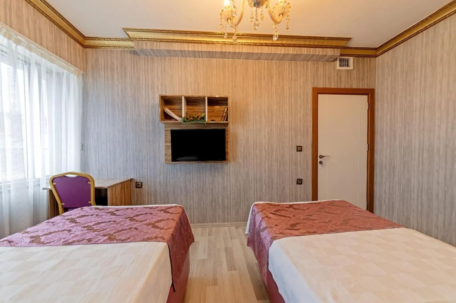 Bed in Royal Babil Suites Hotel