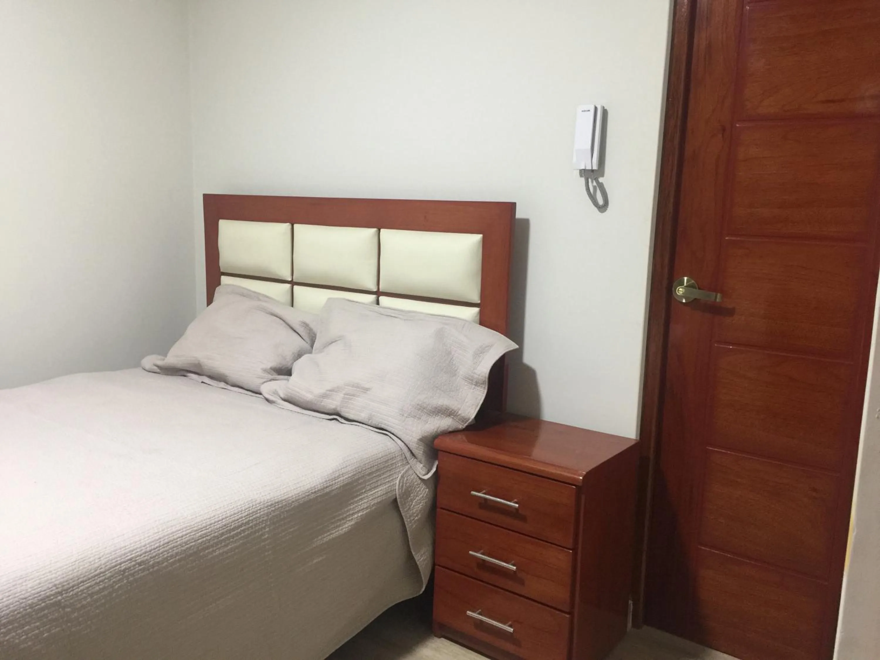 Bed in A-Hope Suite Hotel