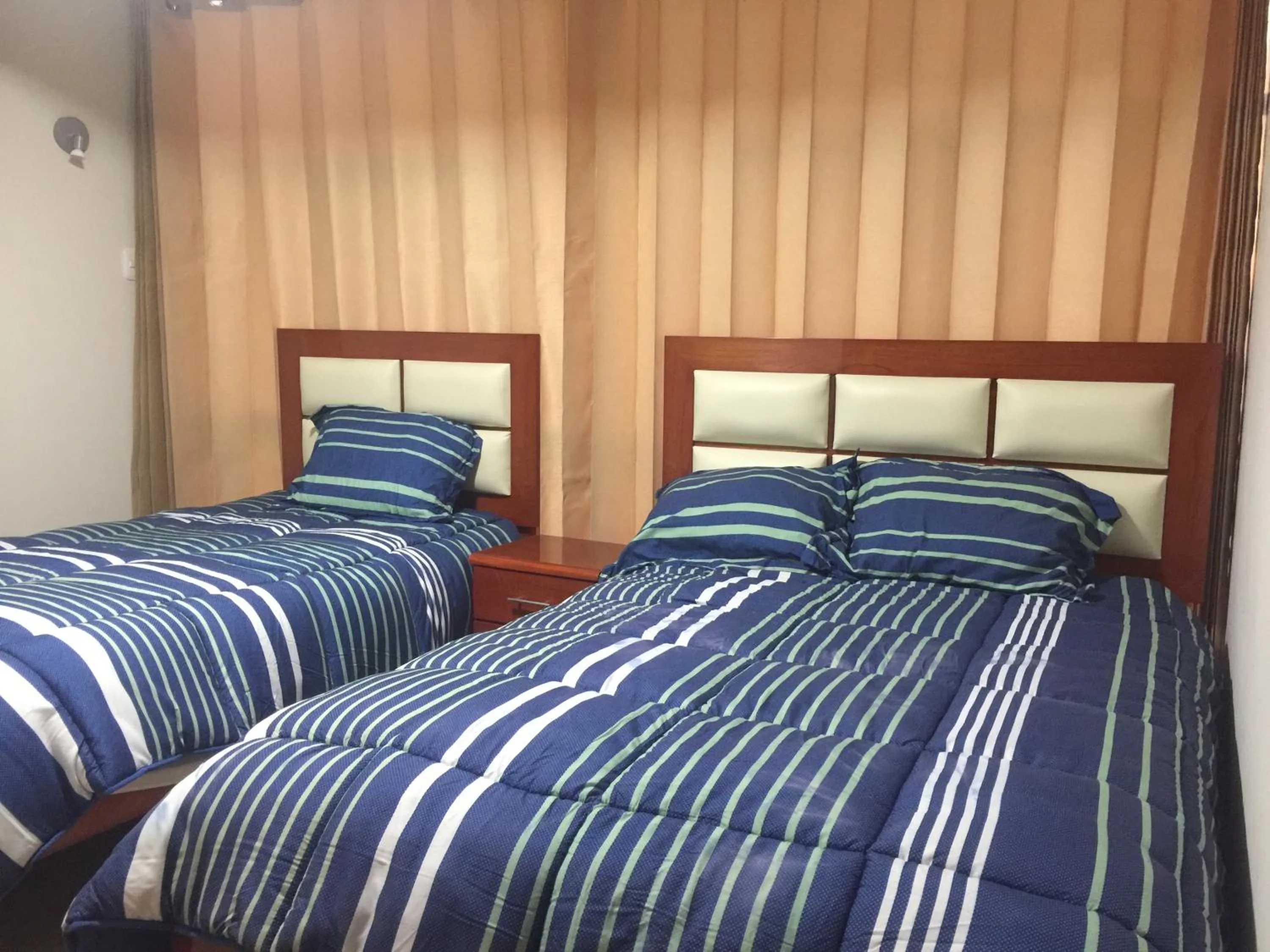 Bed in A-Hope Suite Hotel