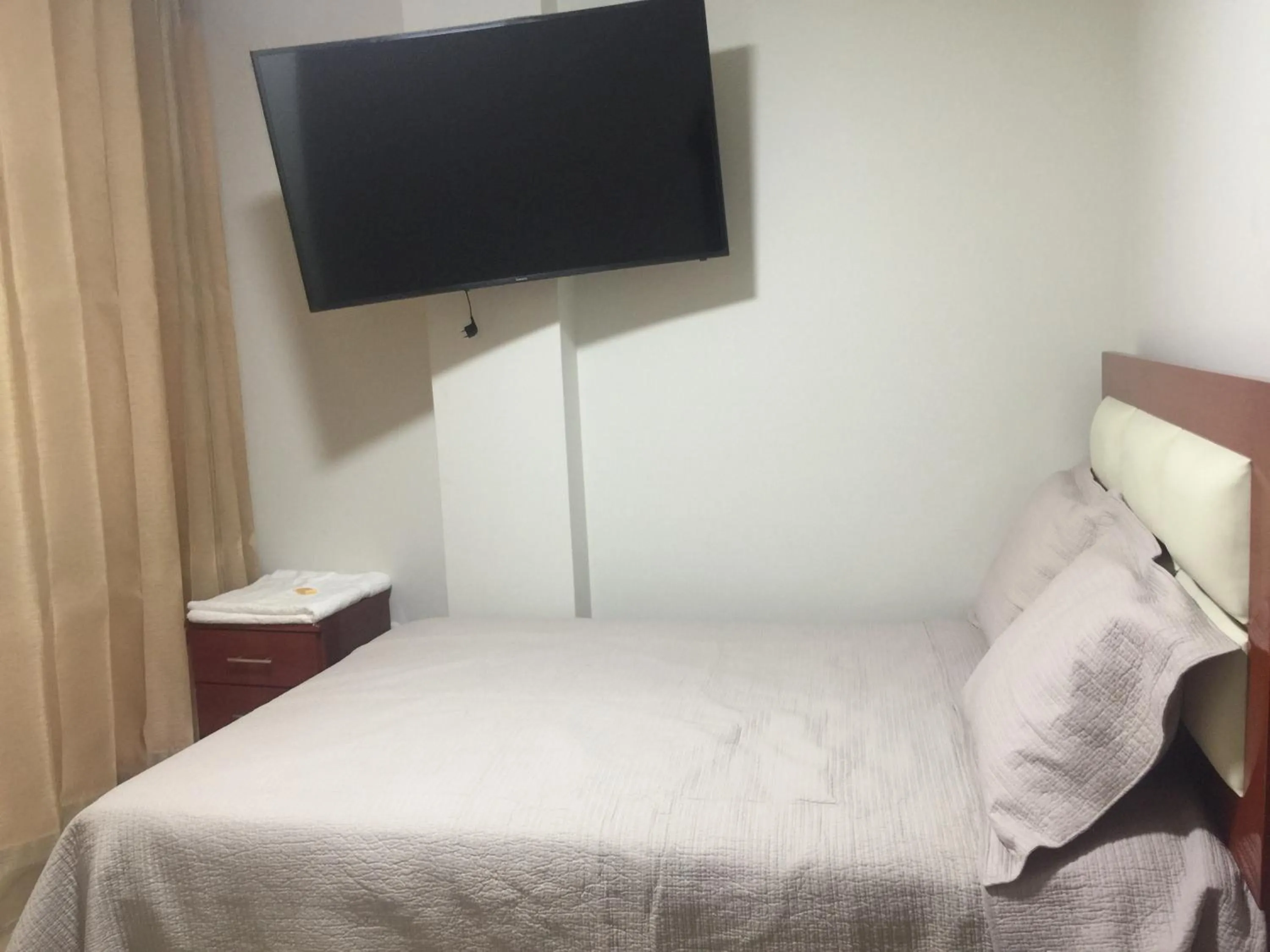 Bed in A-Hope Suite Hotel