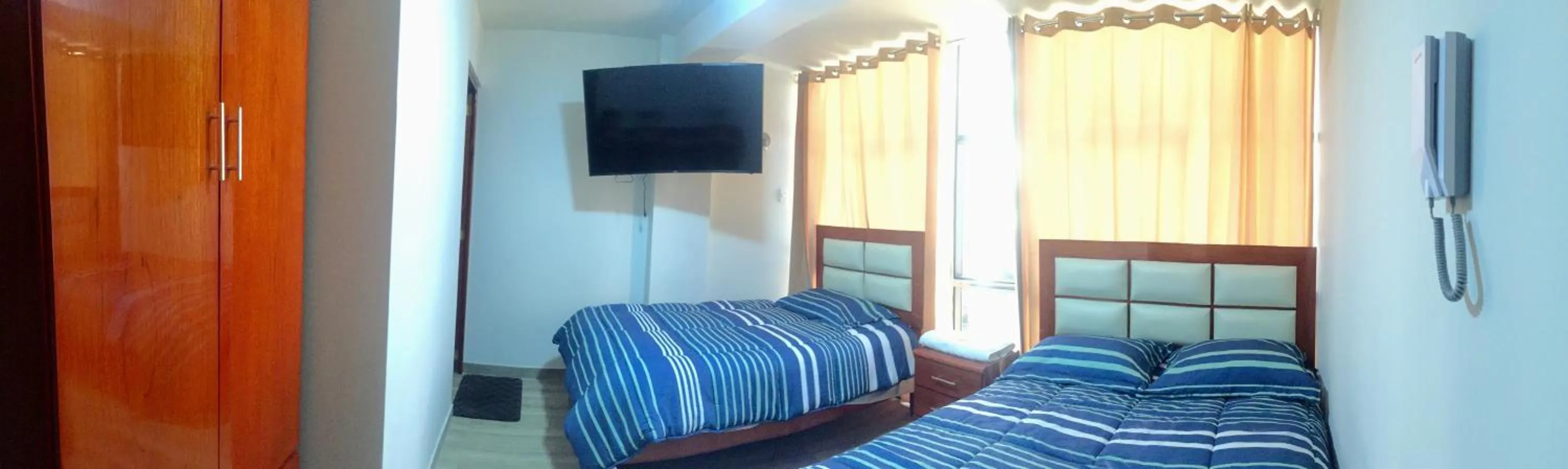 Bed in A-Hope Suite Hotel