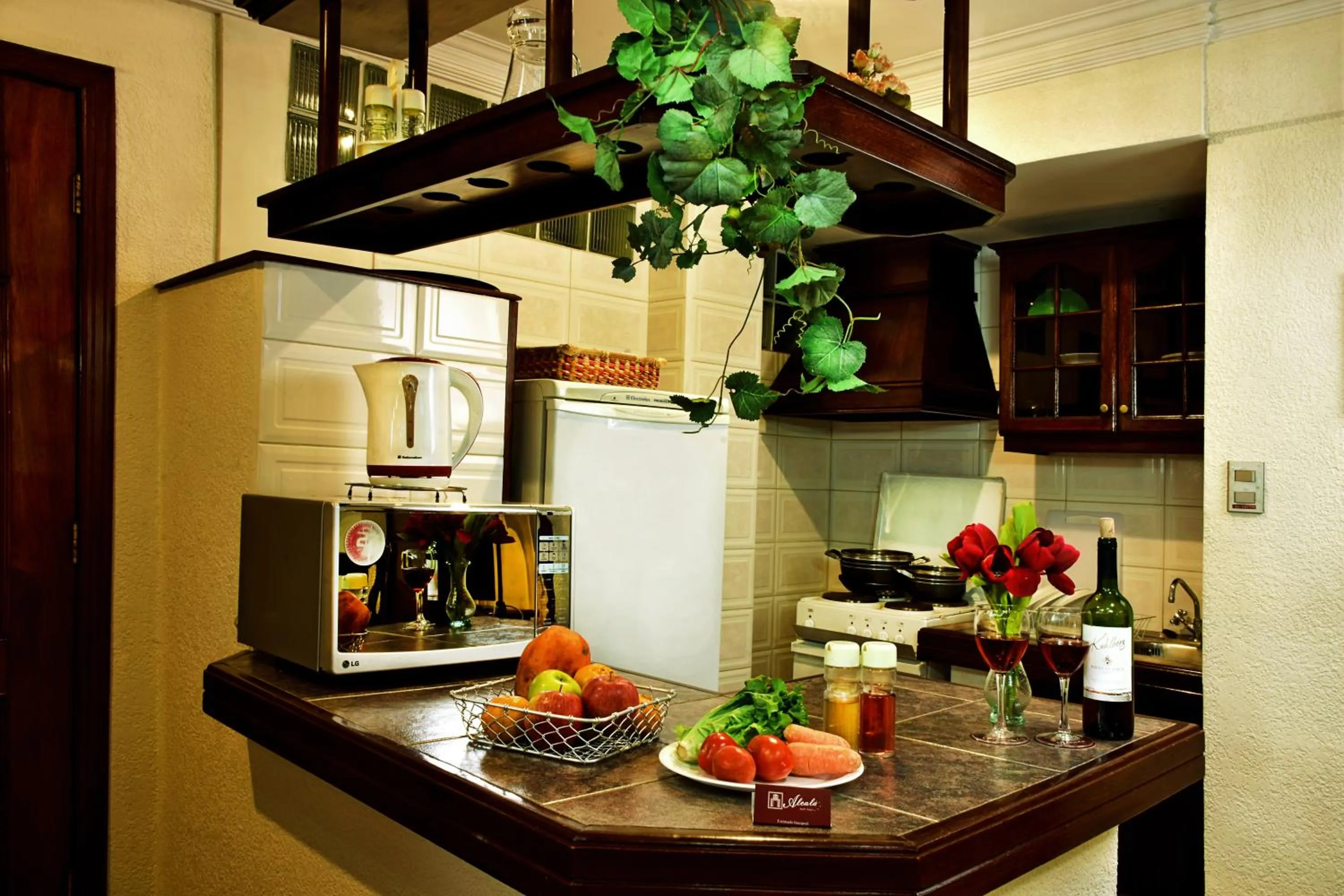 Kitchen or kitchenette in Alcalá Apart Hotel