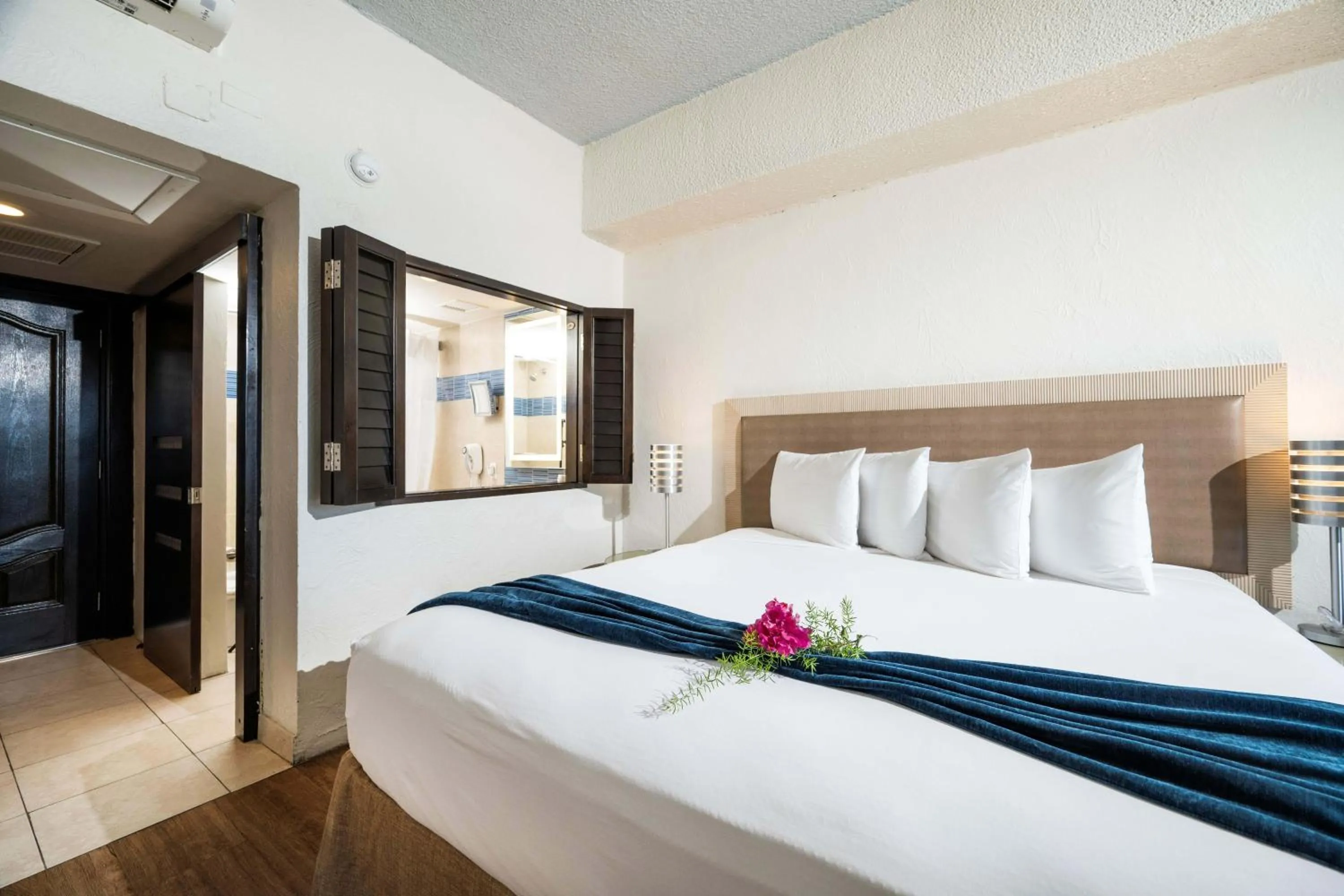 Bed in Windward Passage Hotel