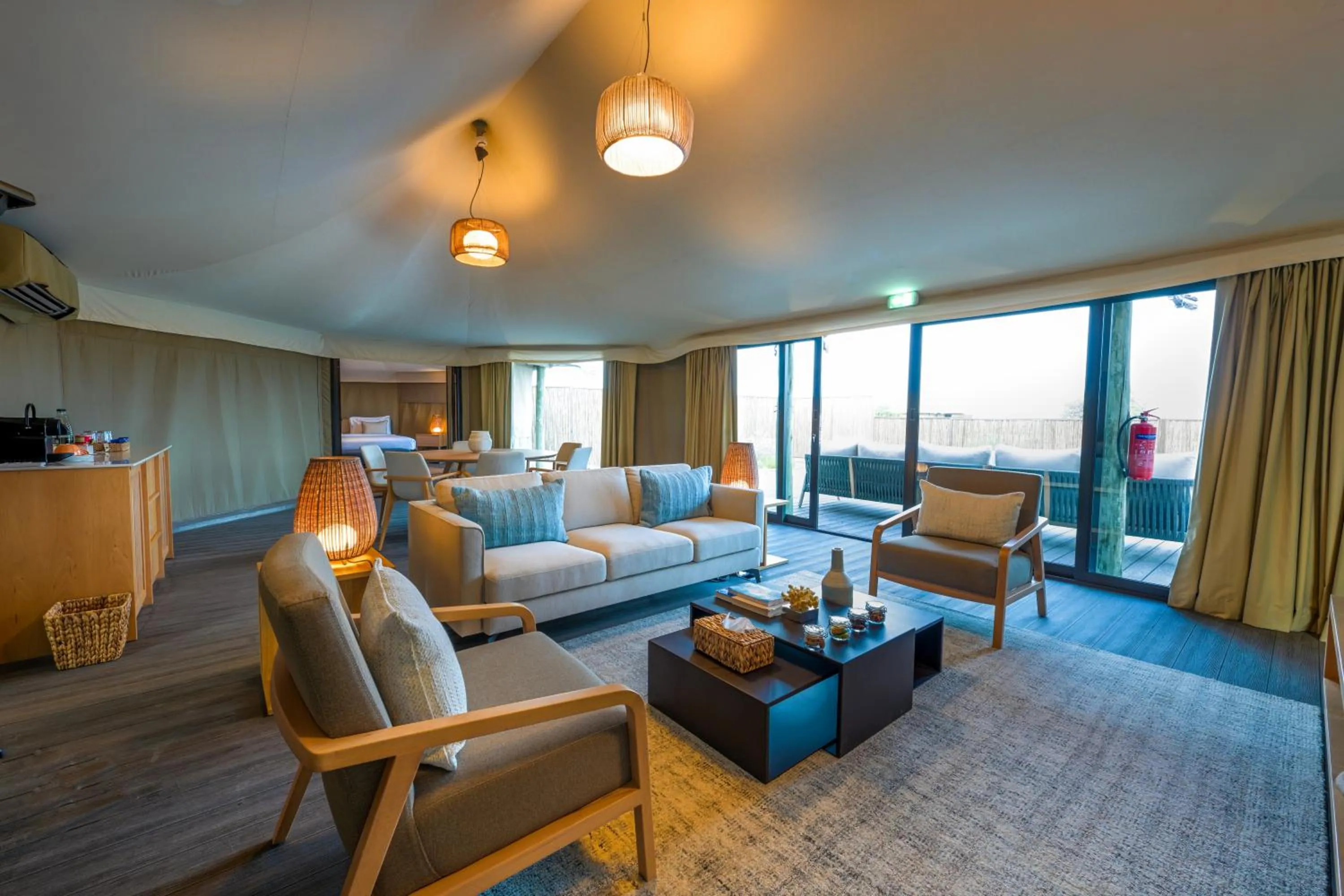 Living room, Bed in Kingfisher Retreat by Sharjah Collection