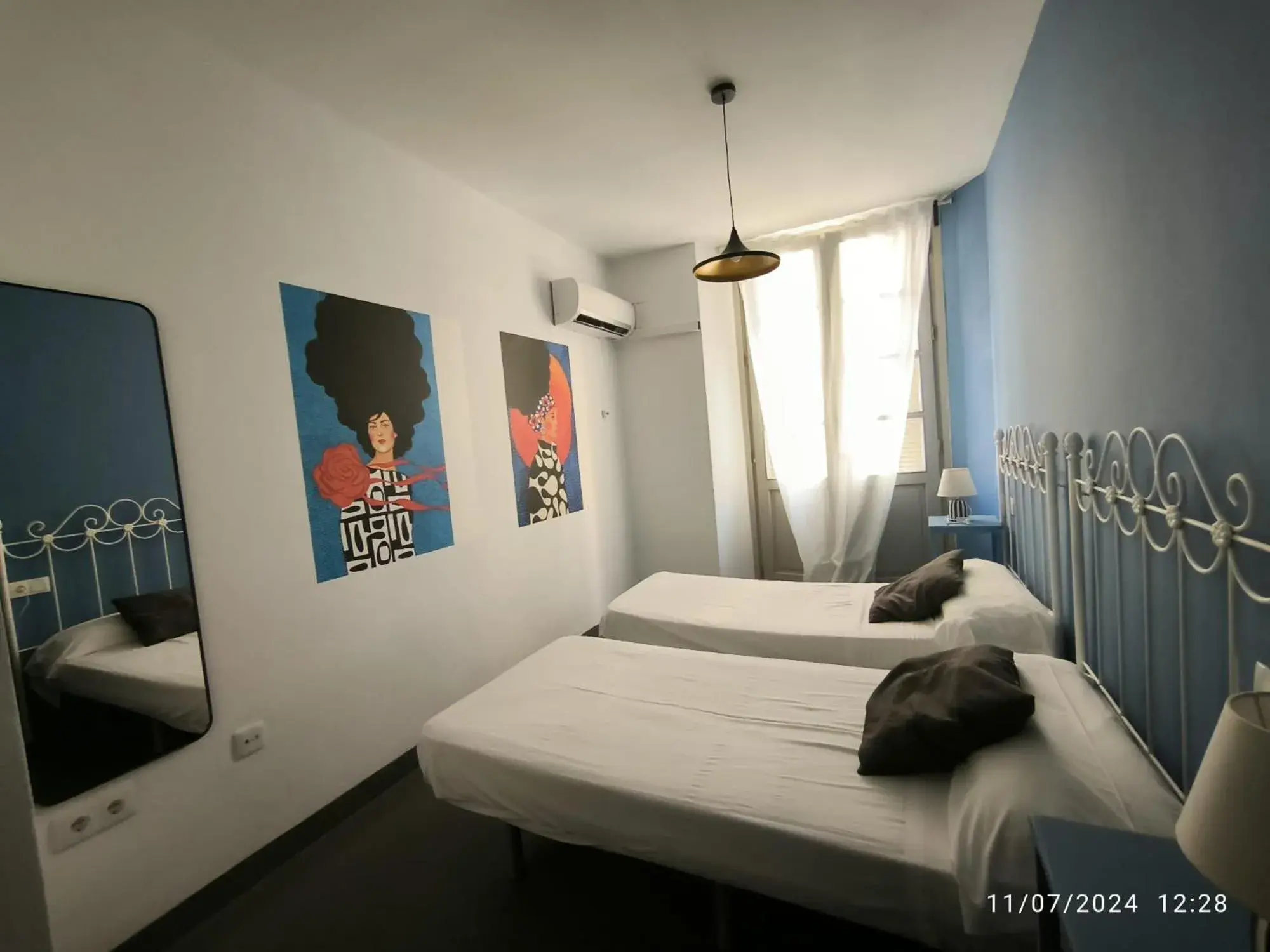 Twin Room with Balcony and Shared Bathroom in Feel Hostels Soho Malaga Twin Room with Balcony and Shared Bathroom in Feel Hostels Soho Malaga