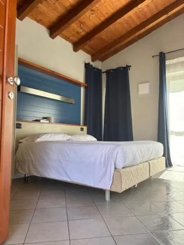 Bed in Albavillage Rooms & Camping