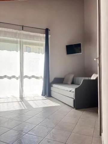 Bed in Albavillage Rooms & Camping