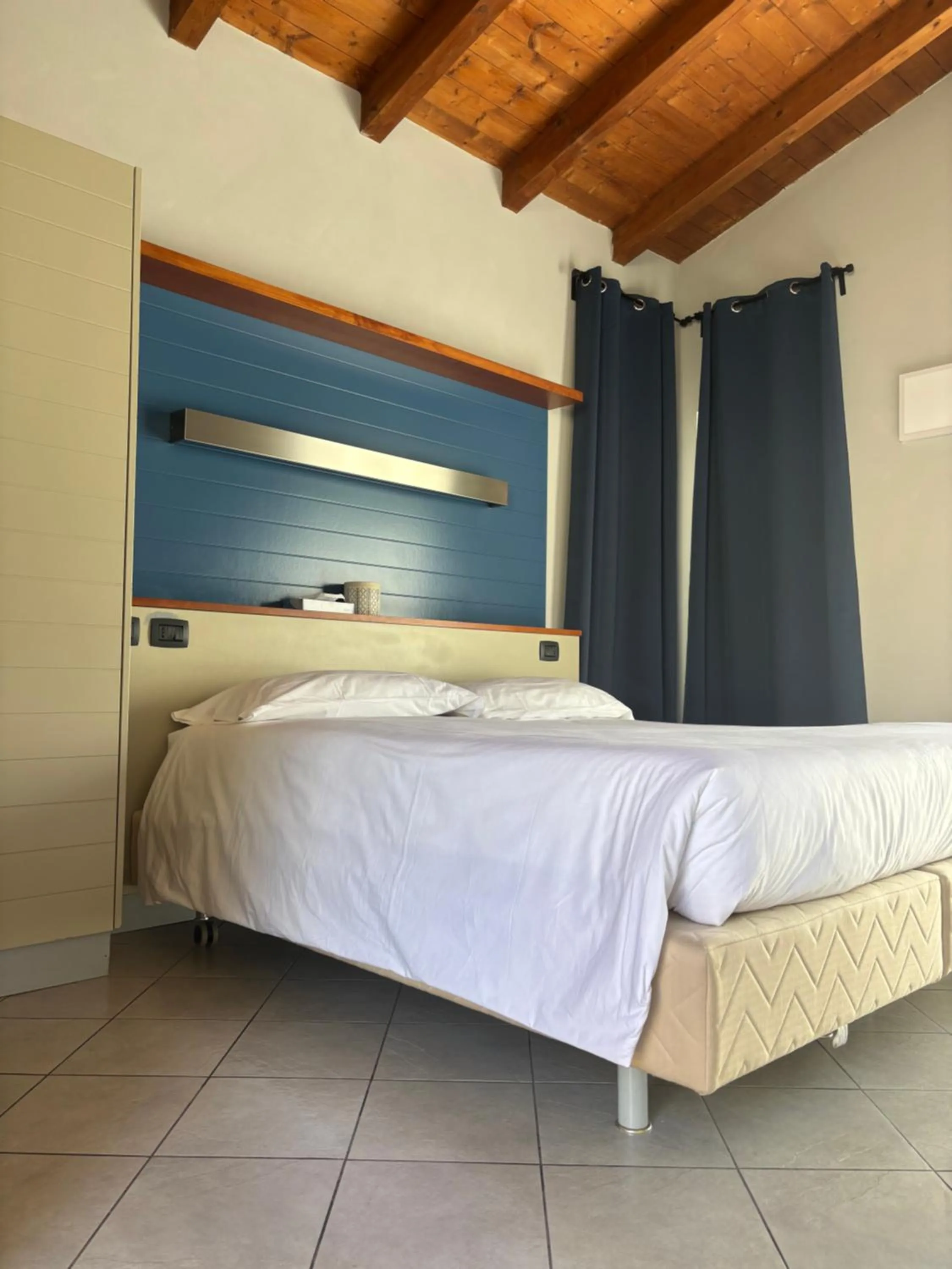 Bed in Albavillage Rooms & Camping