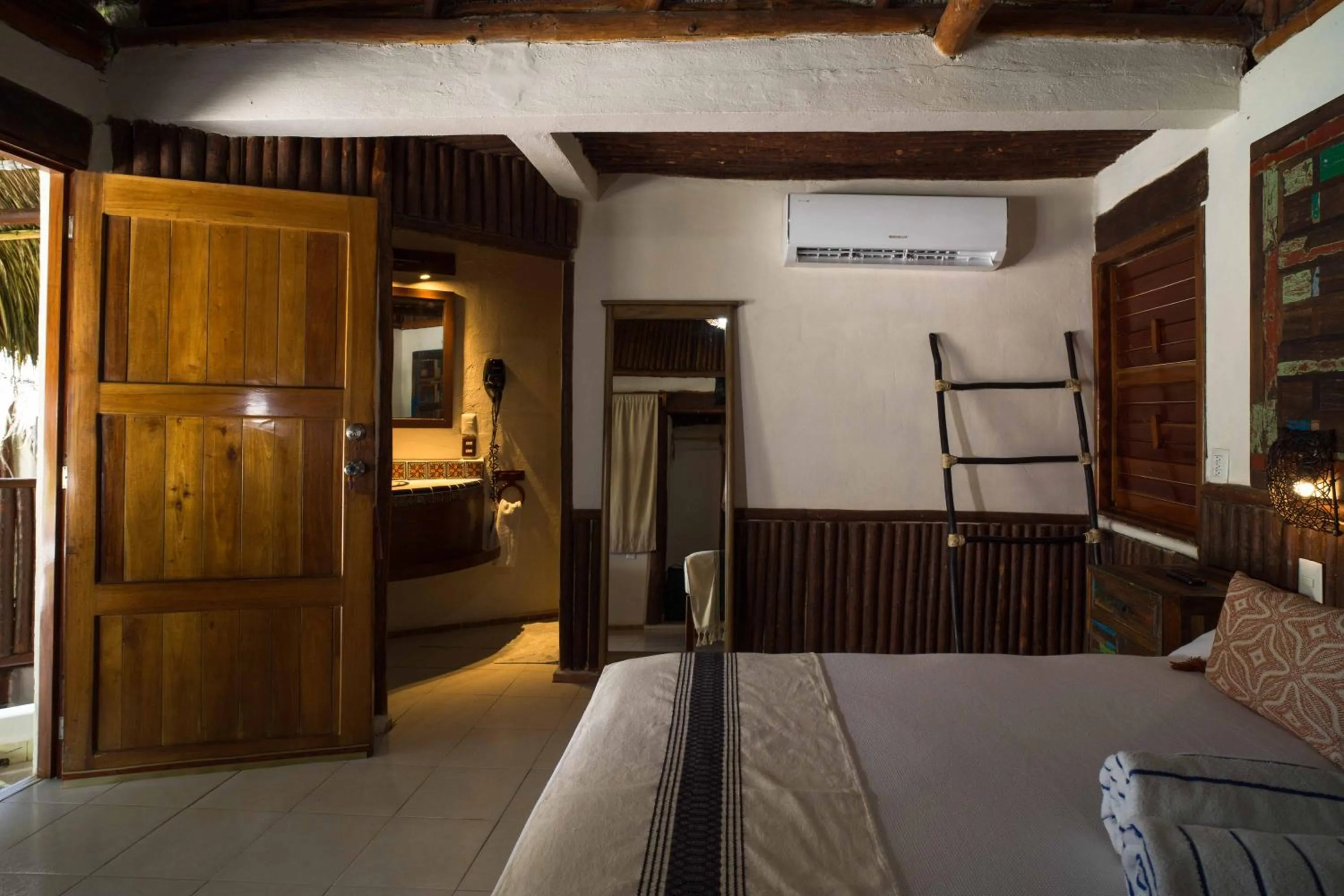 Bed in BT Live Tulum located at the party zone