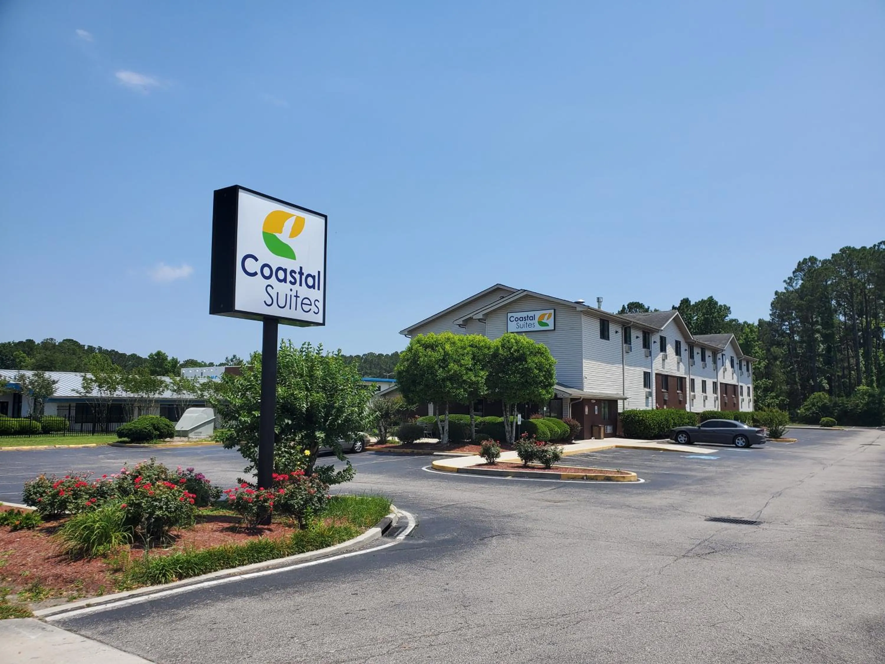 Property building in Coastal Inn & Suites