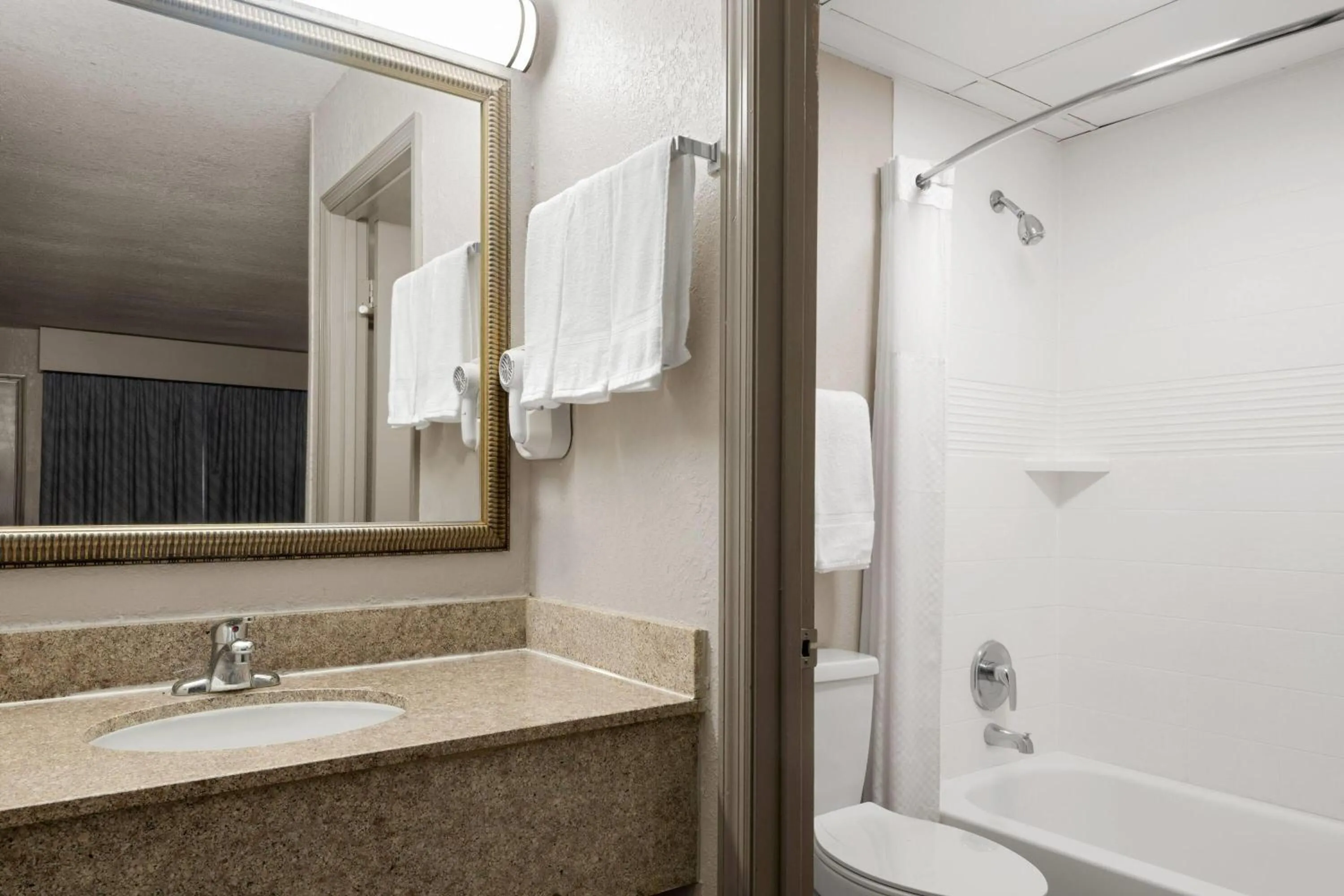 Bathroom in Days Inn by Wyndham Augusta Wheeler Road