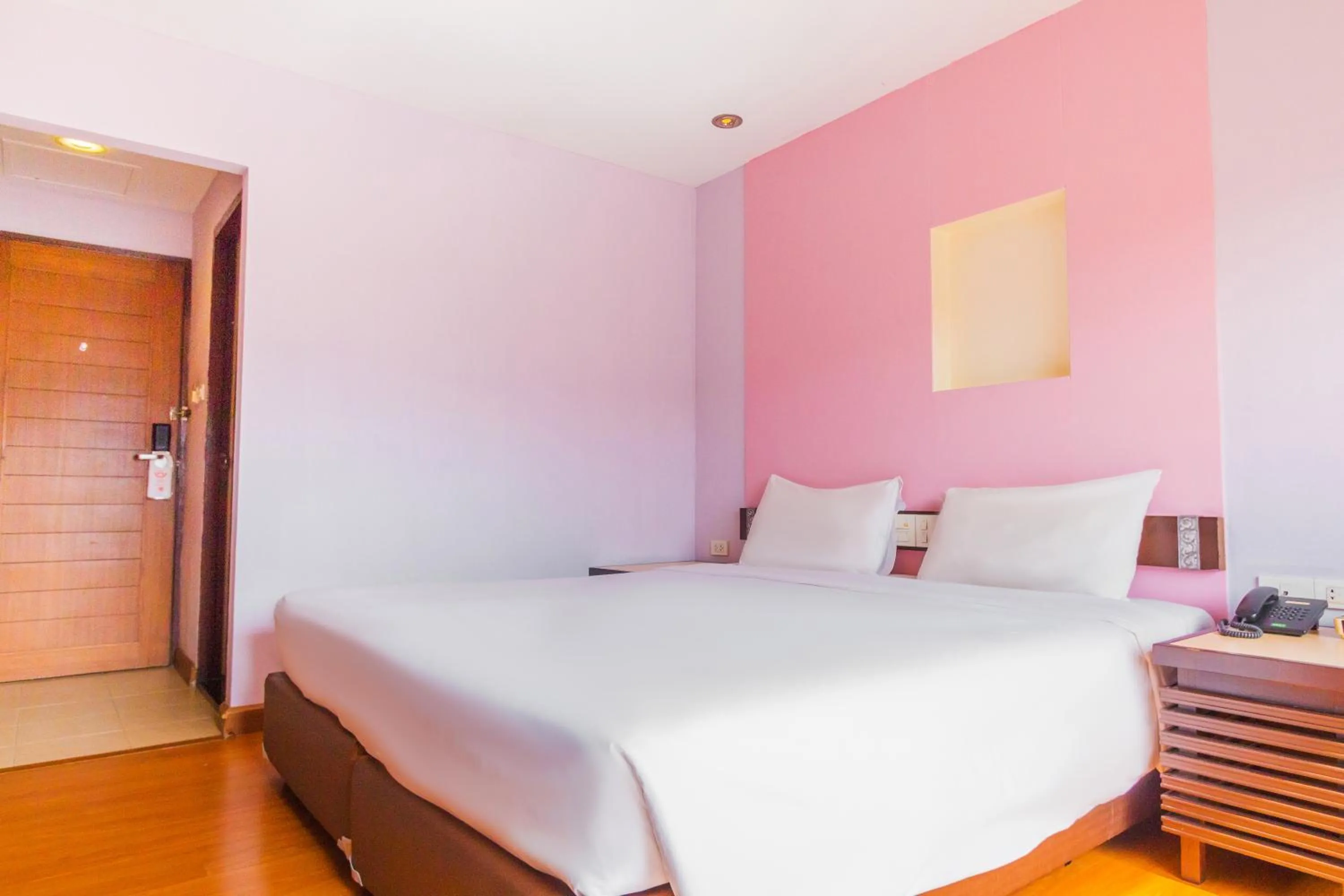 Bed in Mayflower Grande Chiang Mai