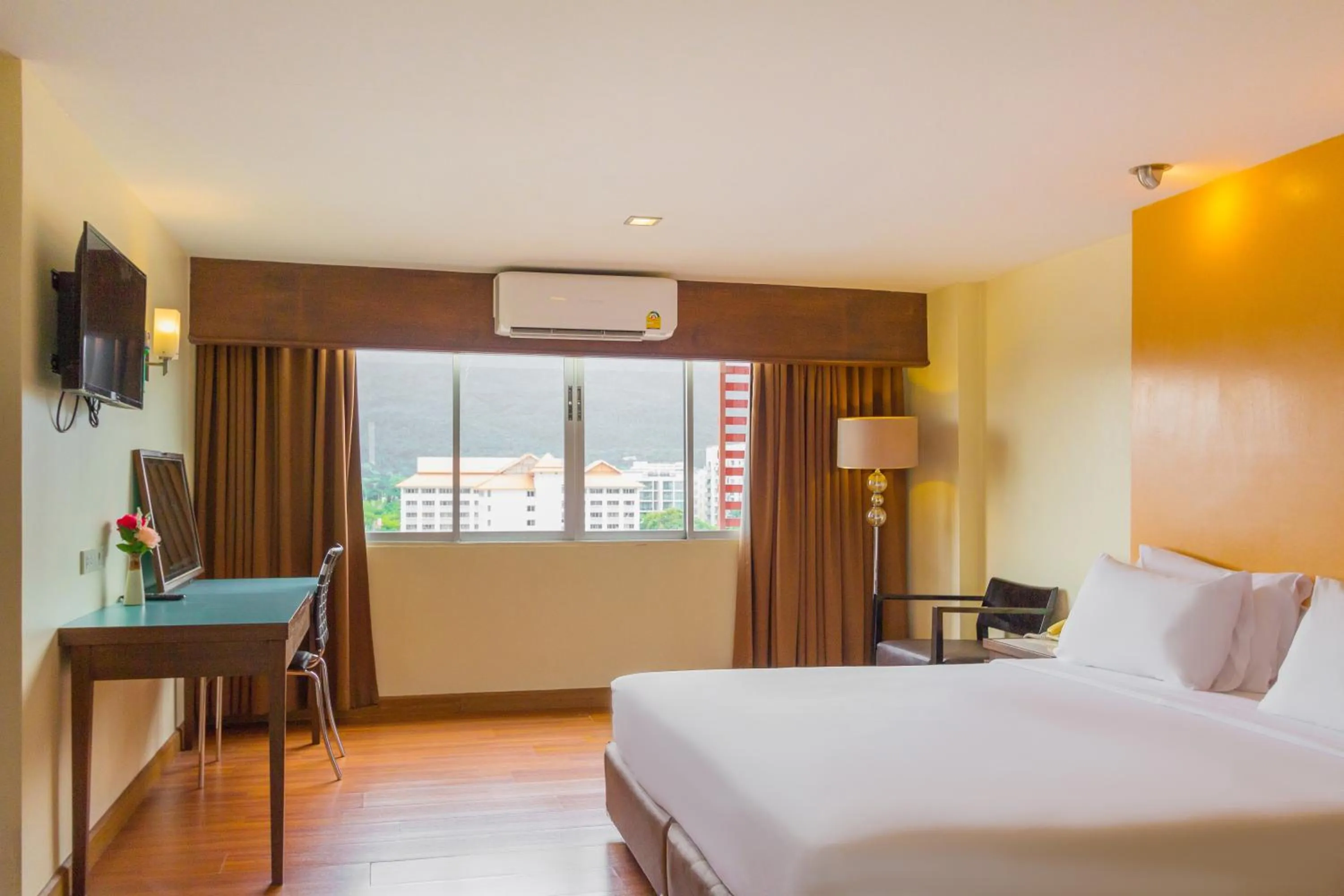 Bed in Mayflower Grande Chiang Mai