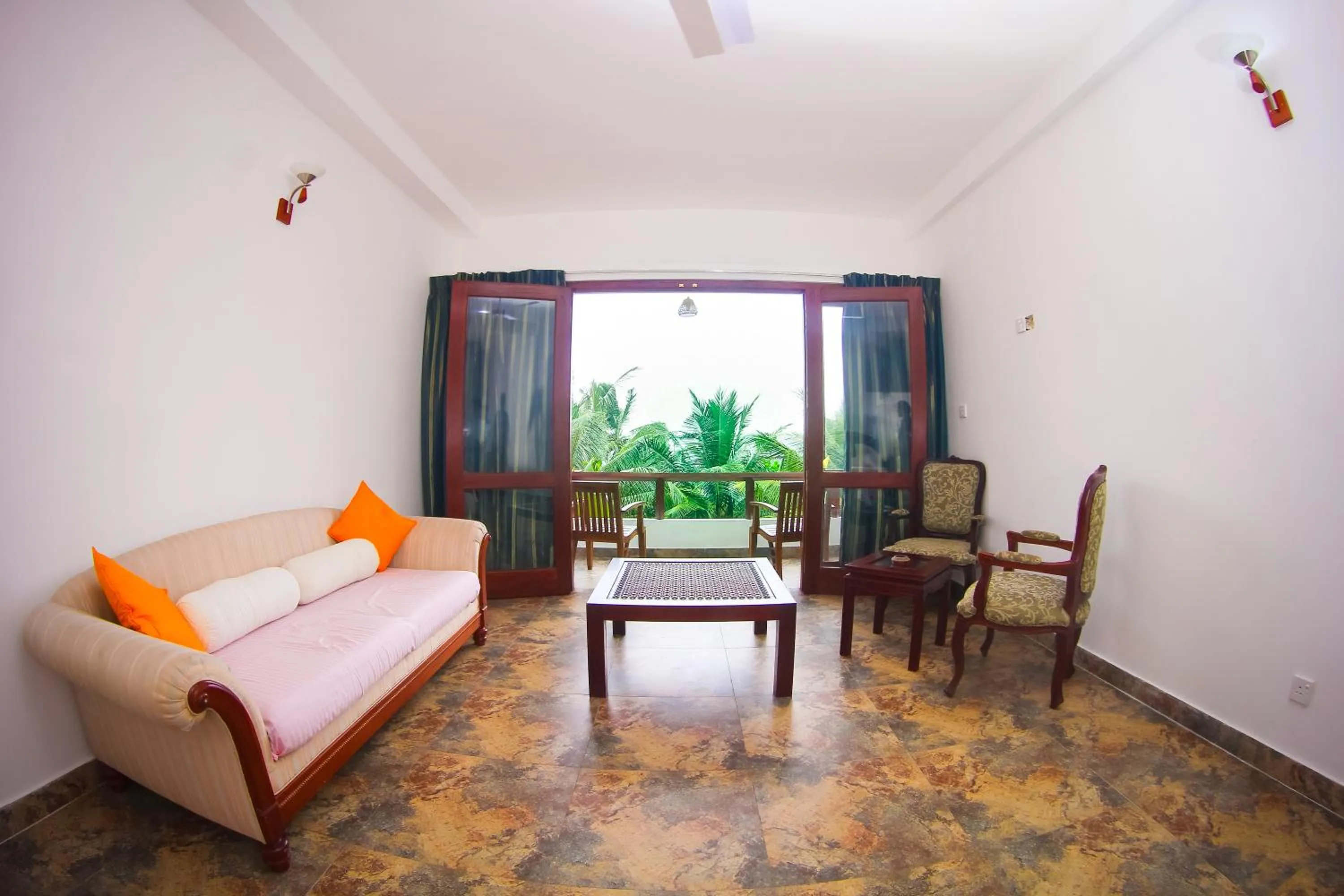 Seating area, Bed in Mother's Place Nimala