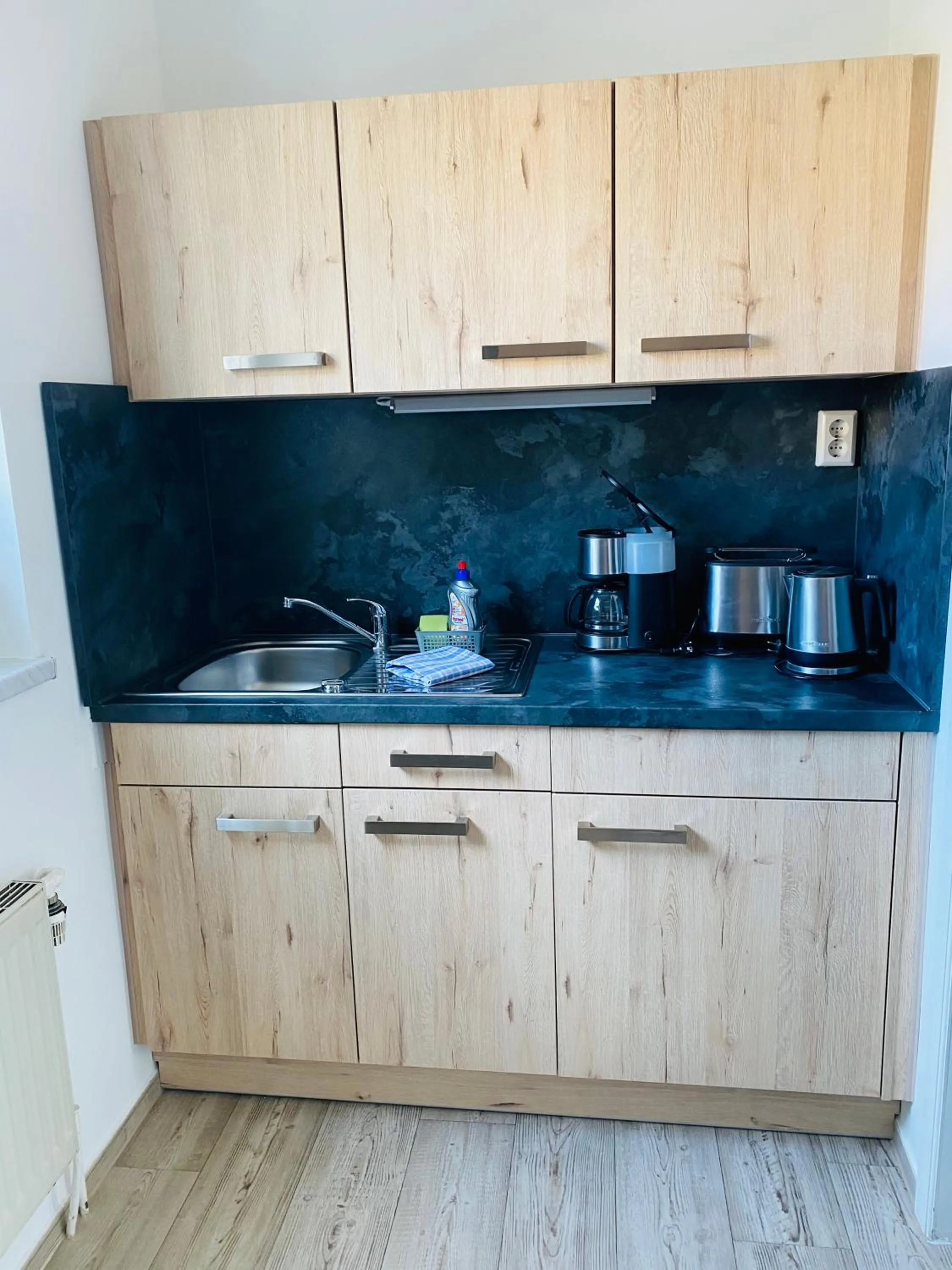 Kitchen or kitchenette in Pension & Ferienwohnungen Schneidereit