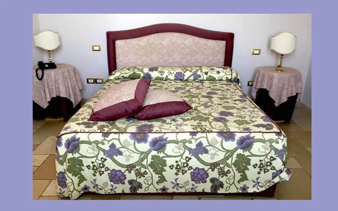 Bed in Hotel Saraceno Al Faro