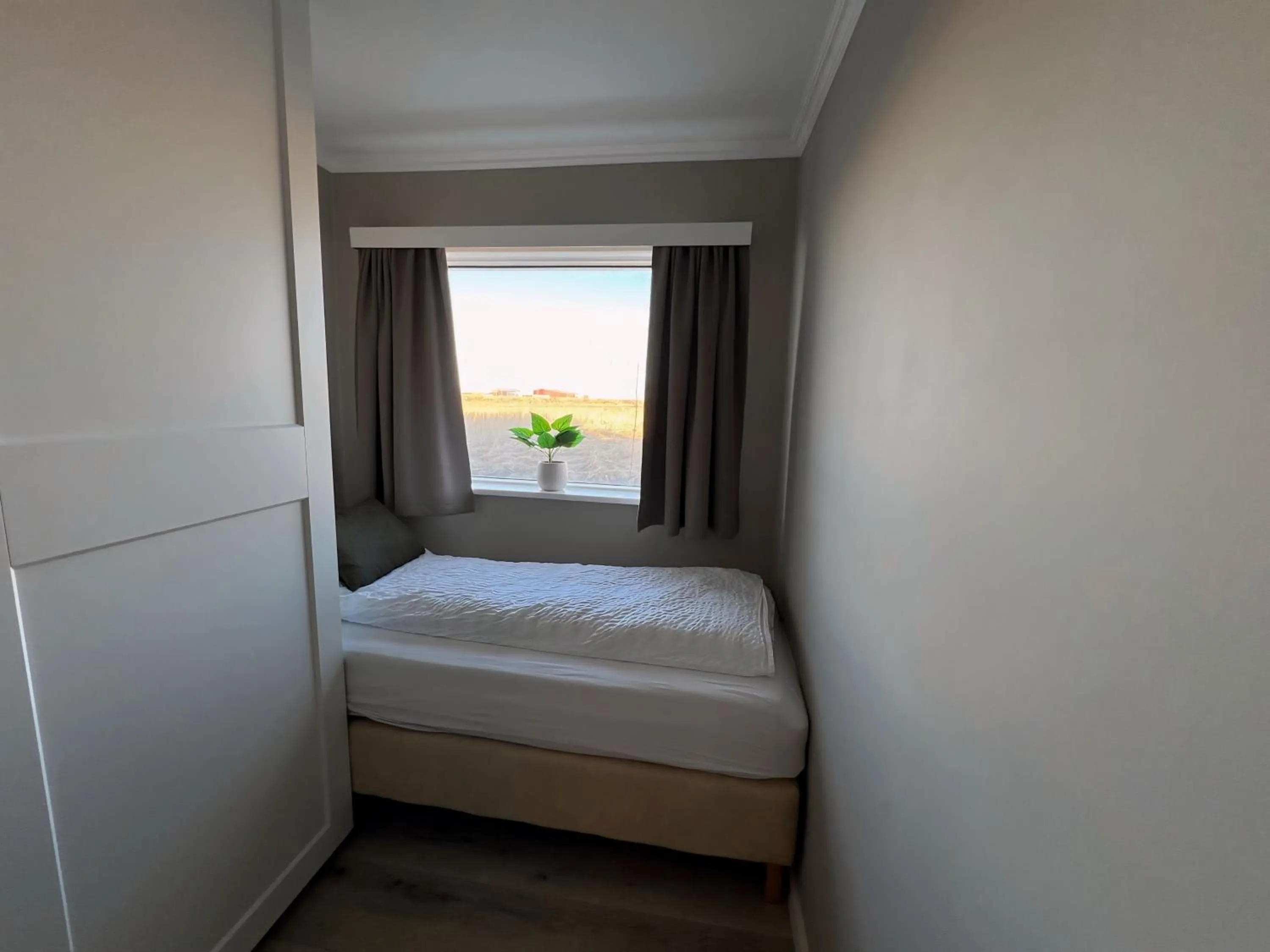 Bed in Garður Apartments