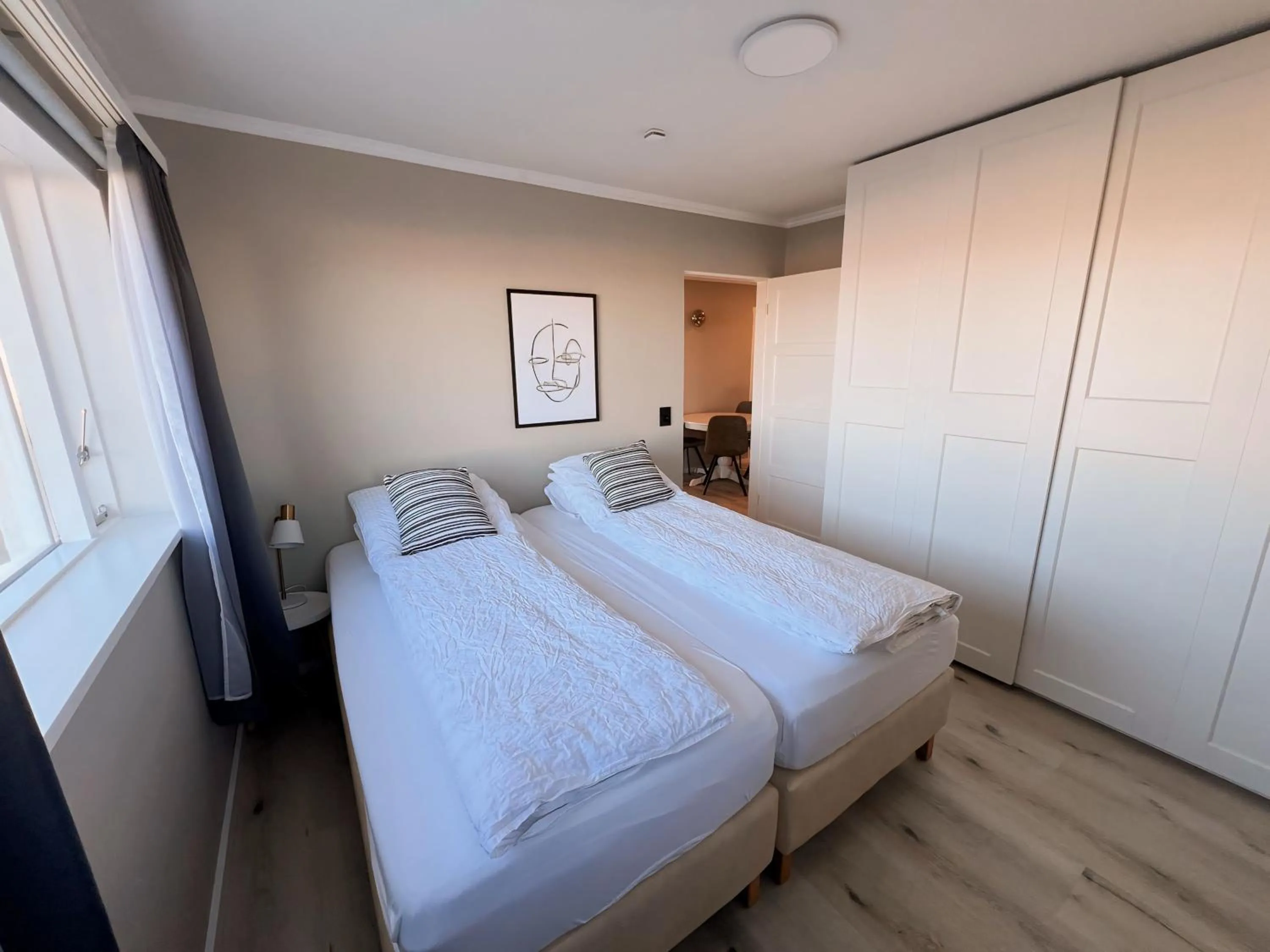 Bed in Garður Apartments