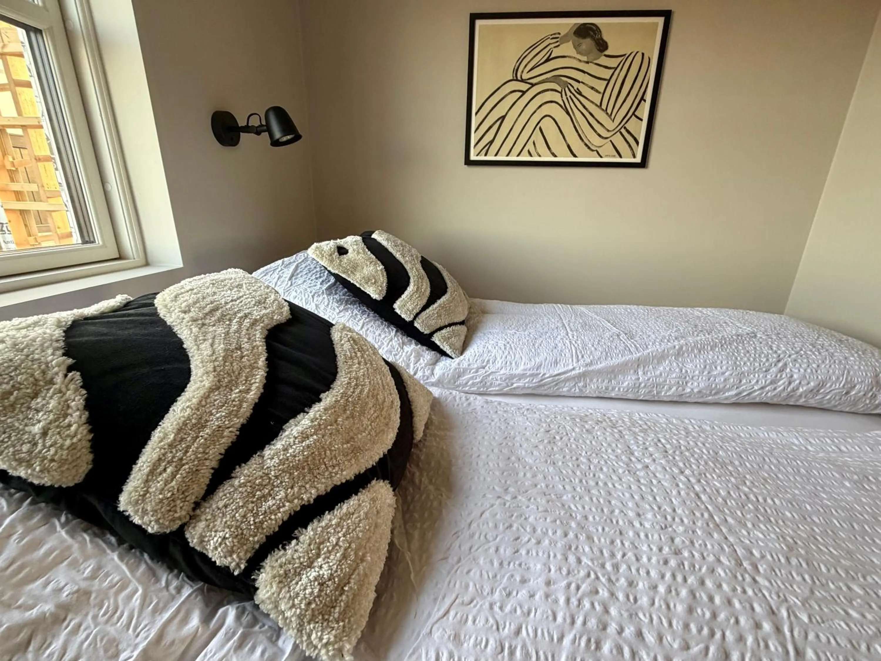 Bed in Garður Apartments