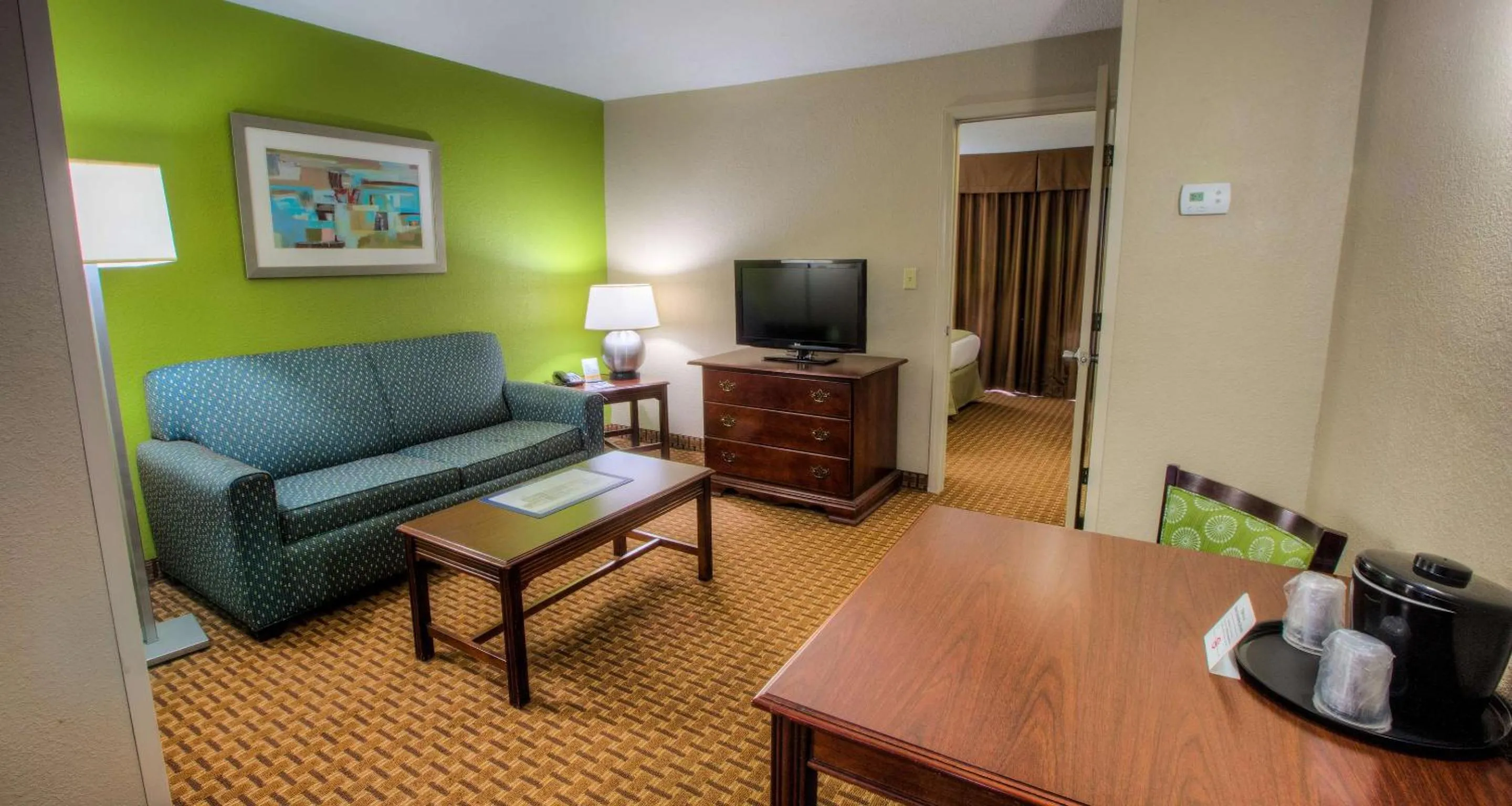 Photo of the whole room, Seating Area in SureStay Plus Hotel by Best Western Raleigh North Downtown