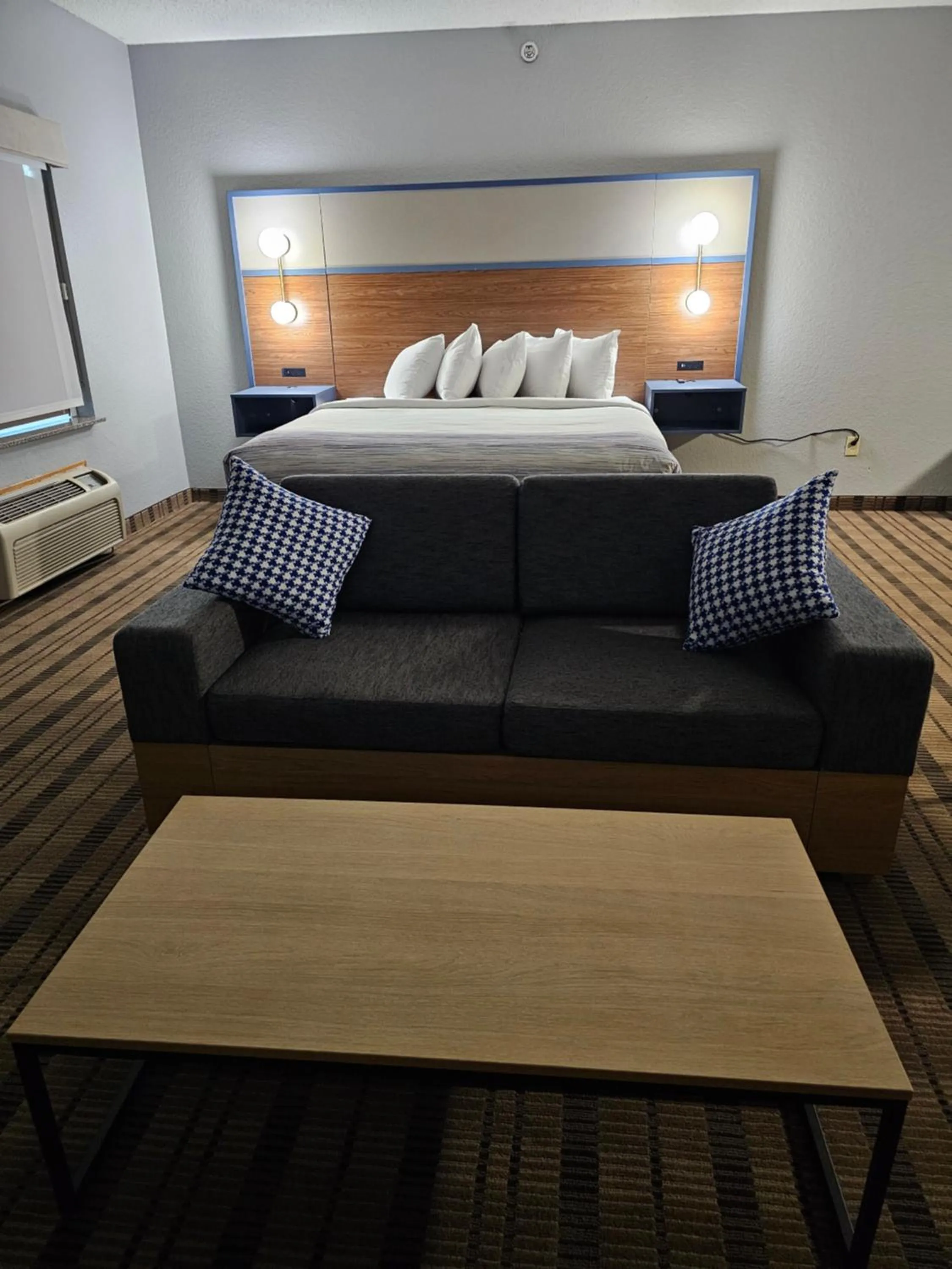 Bed in AmericInn by Wyndham Grinnell