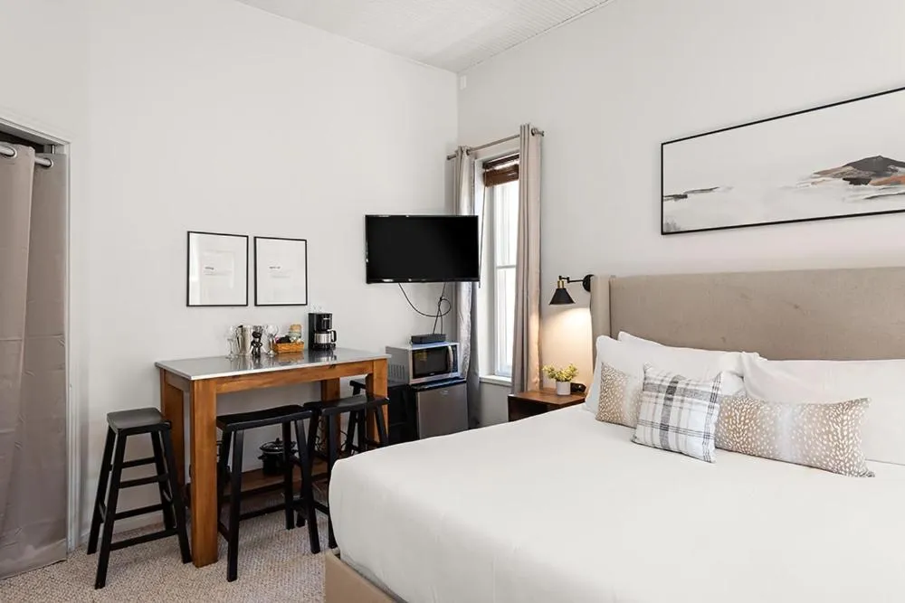 Bed in Independence Square 211, Chic Hotel Room with Mountain Views, A/C, & Rooftop Hot Tub