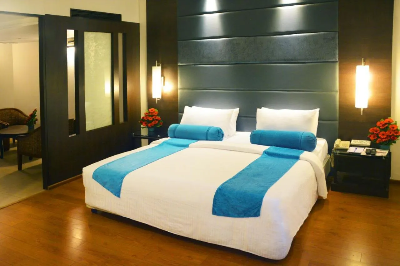 Bed in Ashraya International Hotel