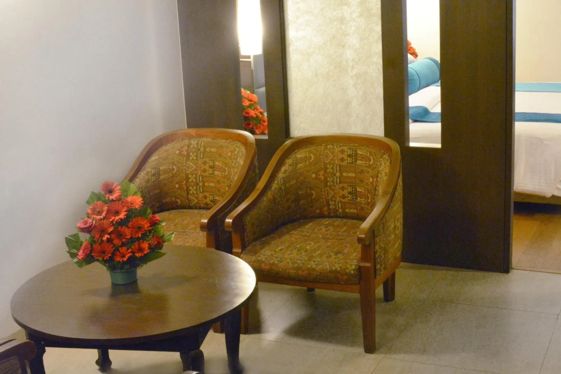 Living room in Ashraya International Hotel