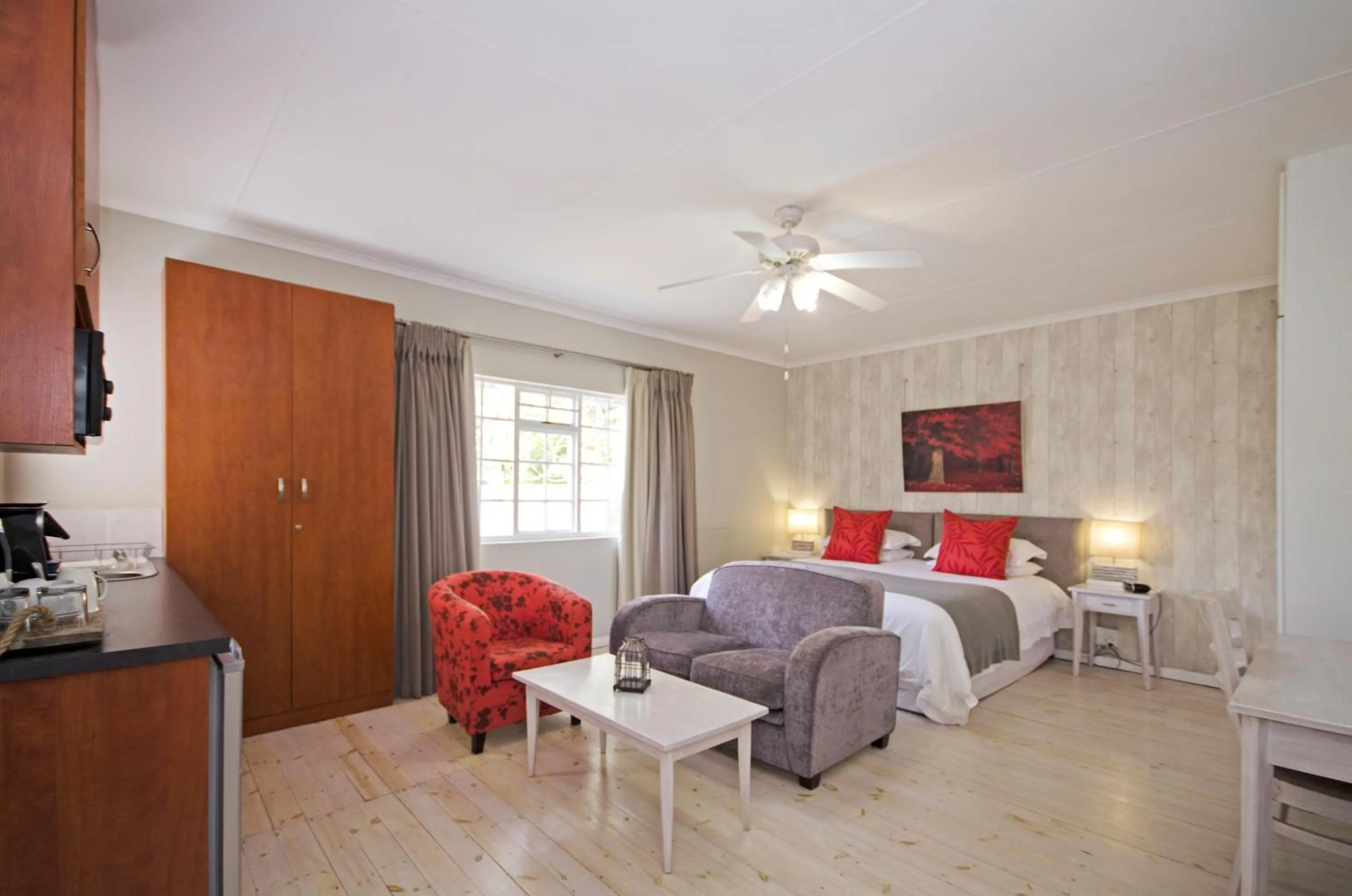 Living room, Bed in Lodge on Main Guest House and Conference Centre