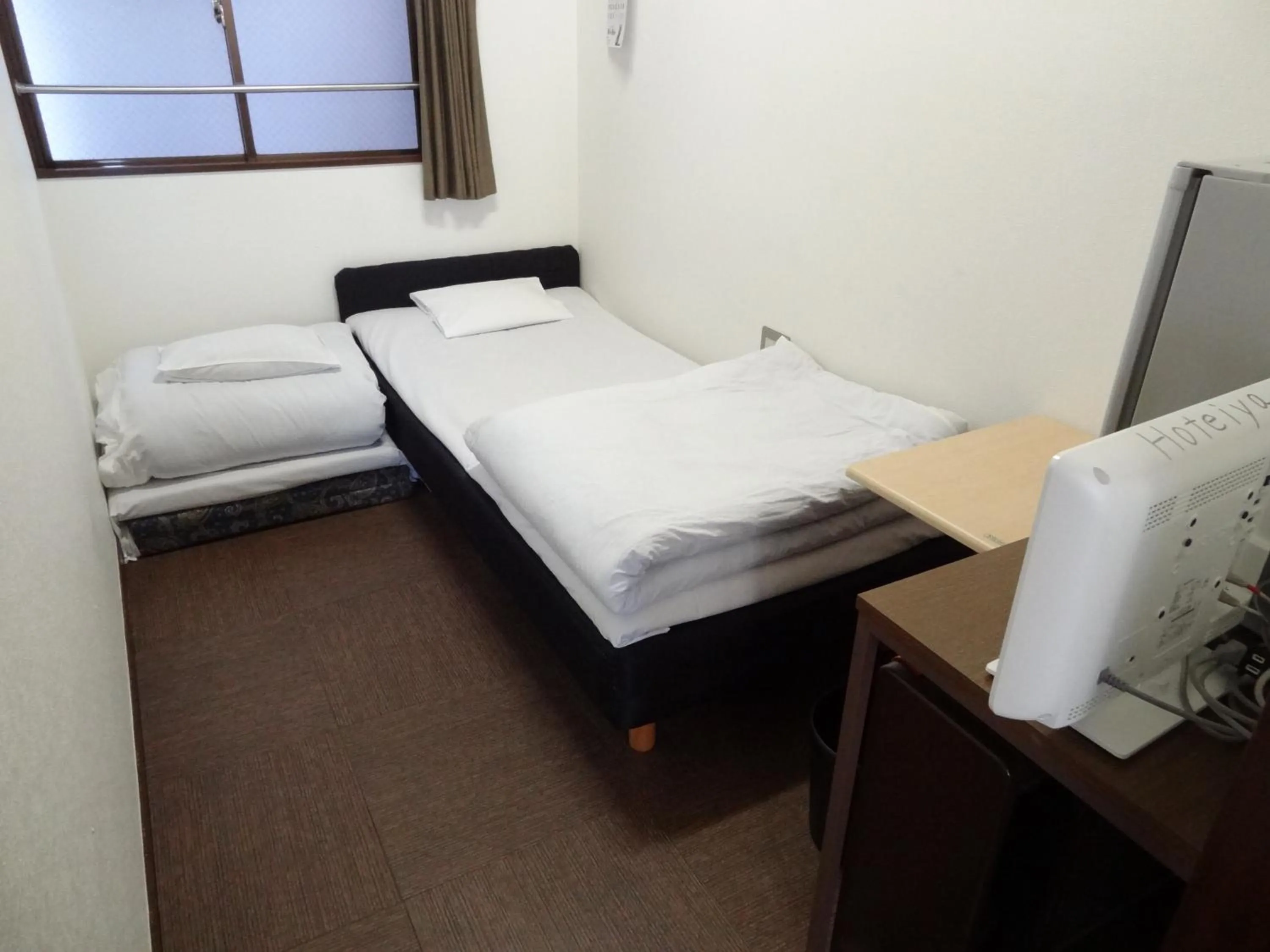 Photo of the whole room, Bed in Economy Hotel Hoteiya