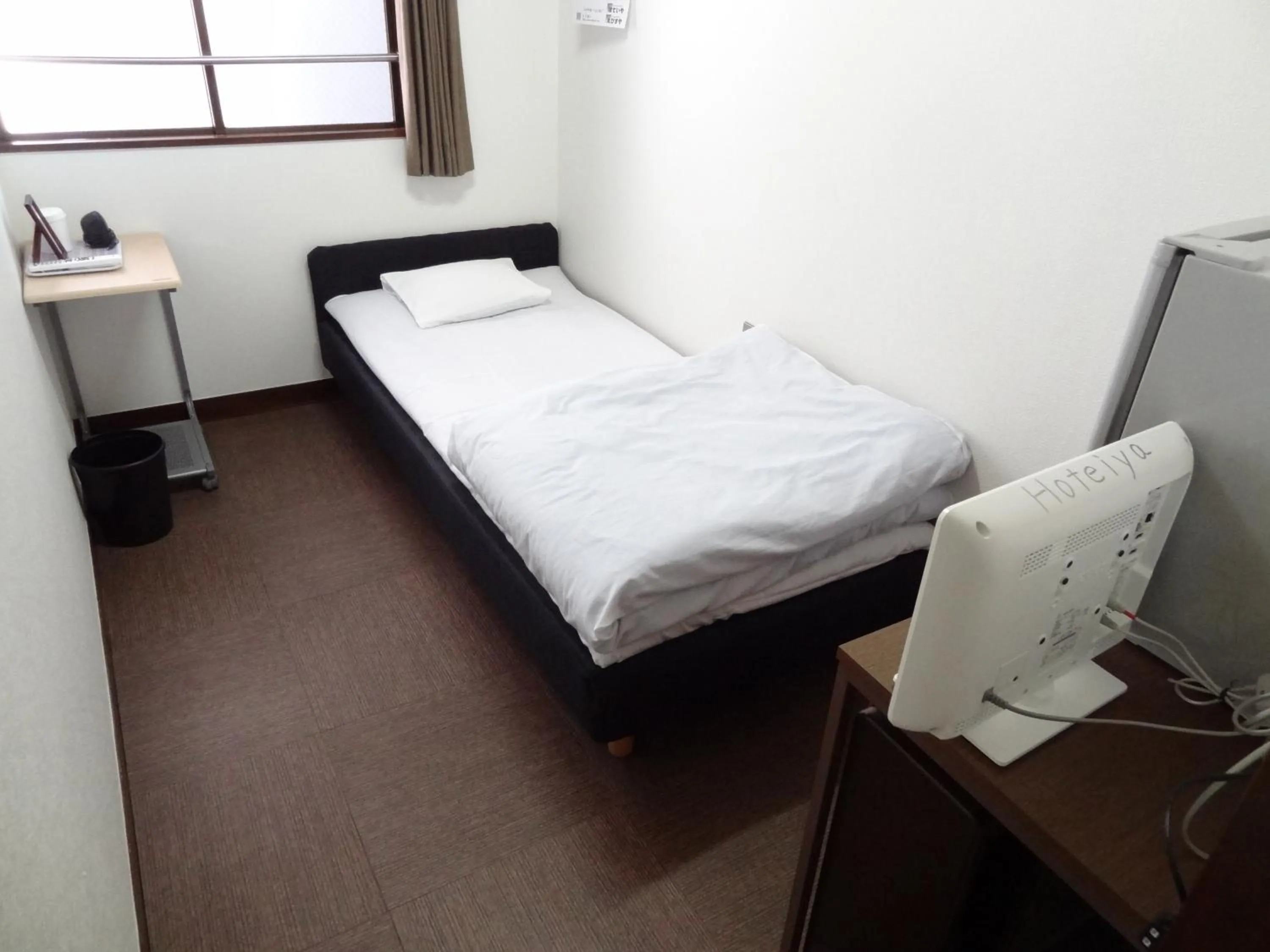 Bed in Economy Hotel Hoteiya