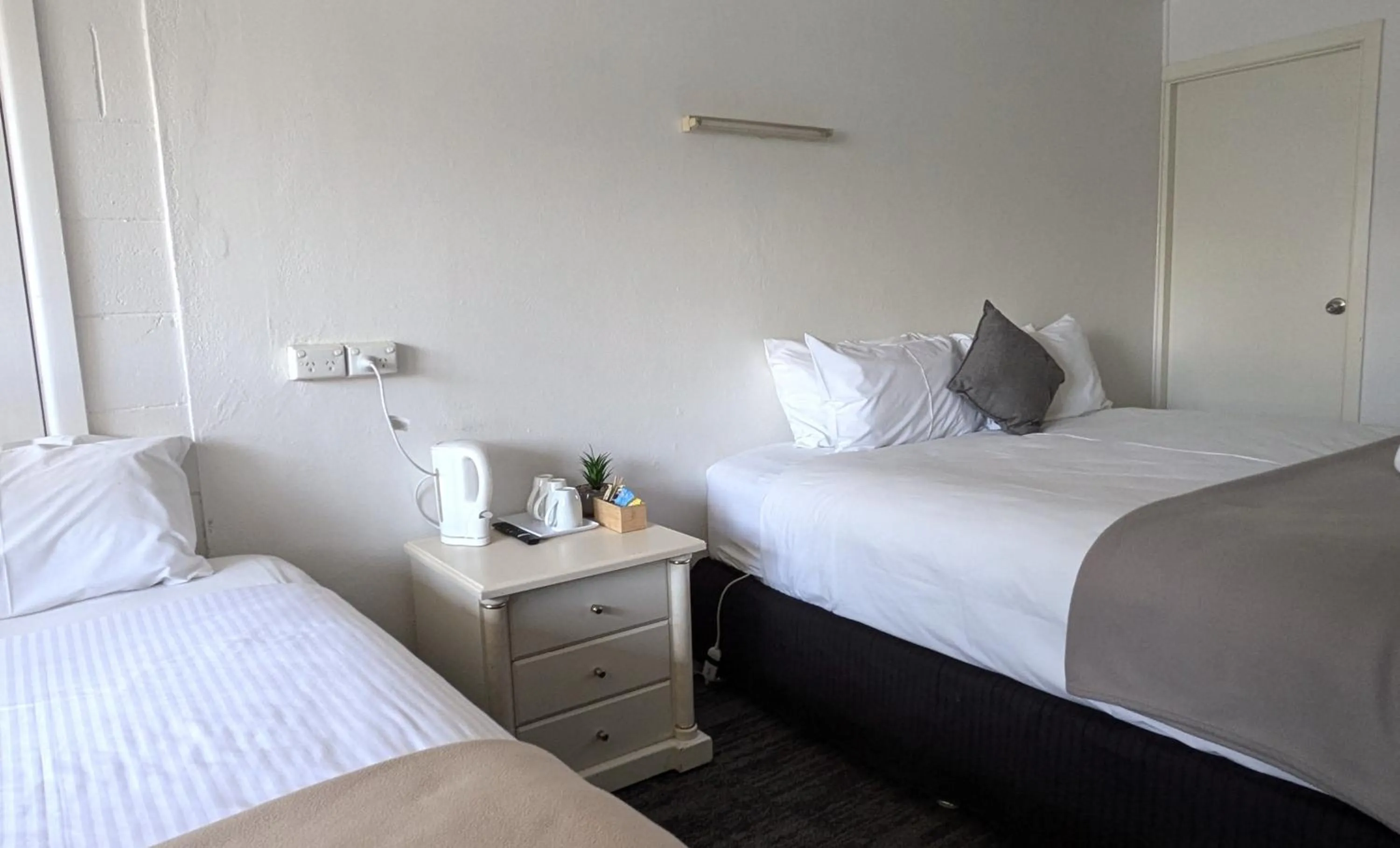 Bed in The Swiss Motel