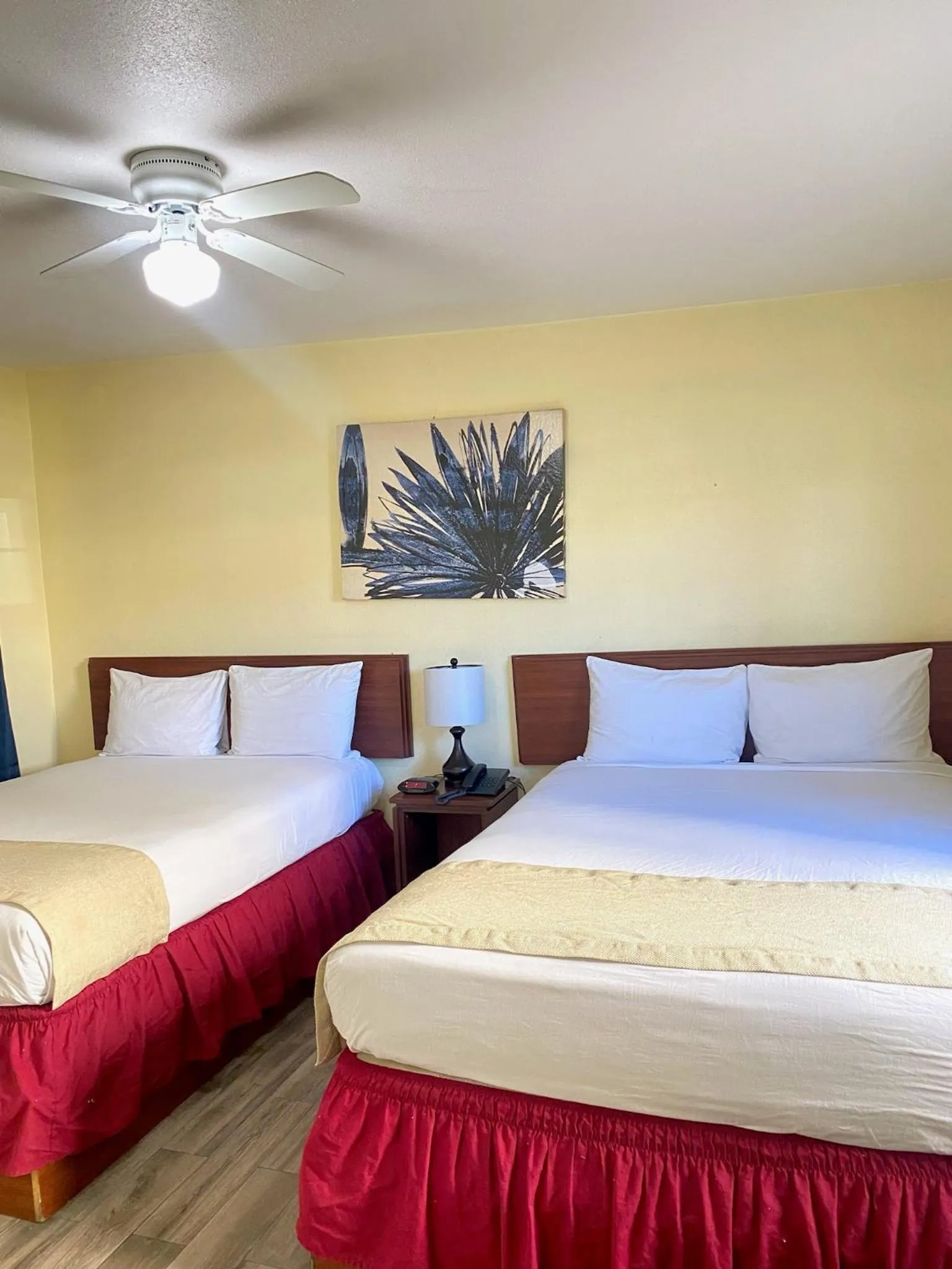 Bed in Europa Inn & Suites