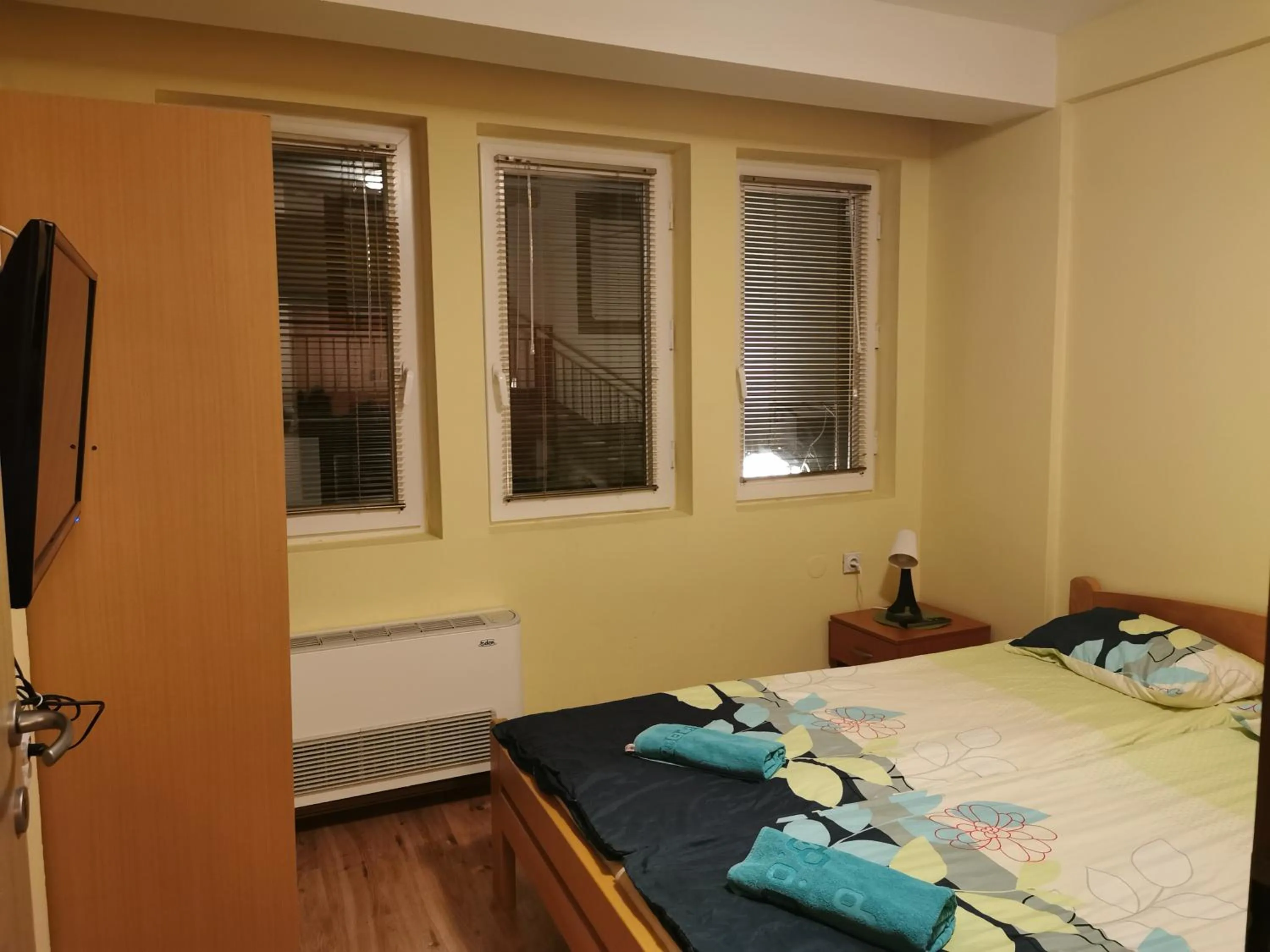 Bed in Lukanov Apartments & Guest Rooms