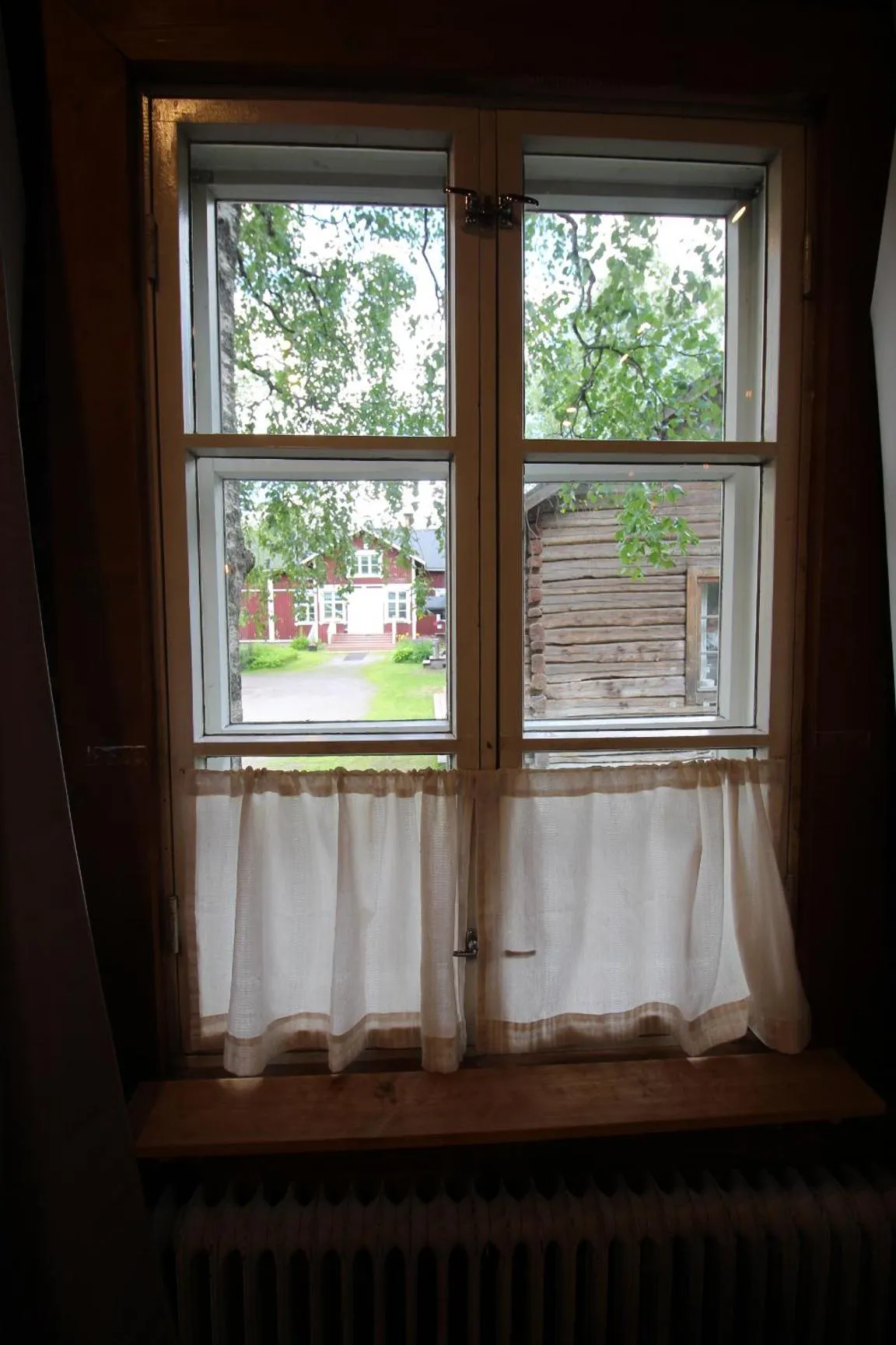 Inner courtyard view in LAURI Historical Log House Manor