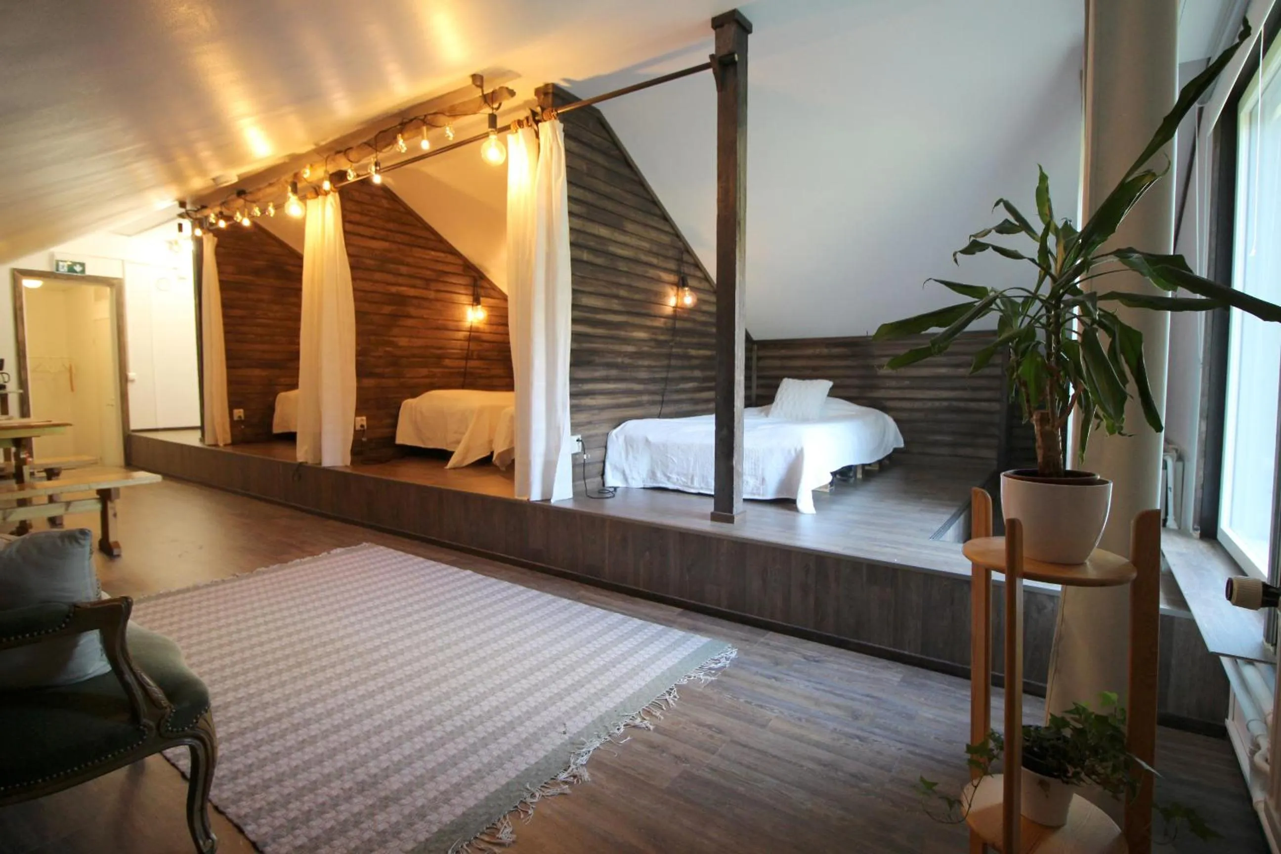 Photo of the whole room, Bed in LAURI Historical Log House Manor