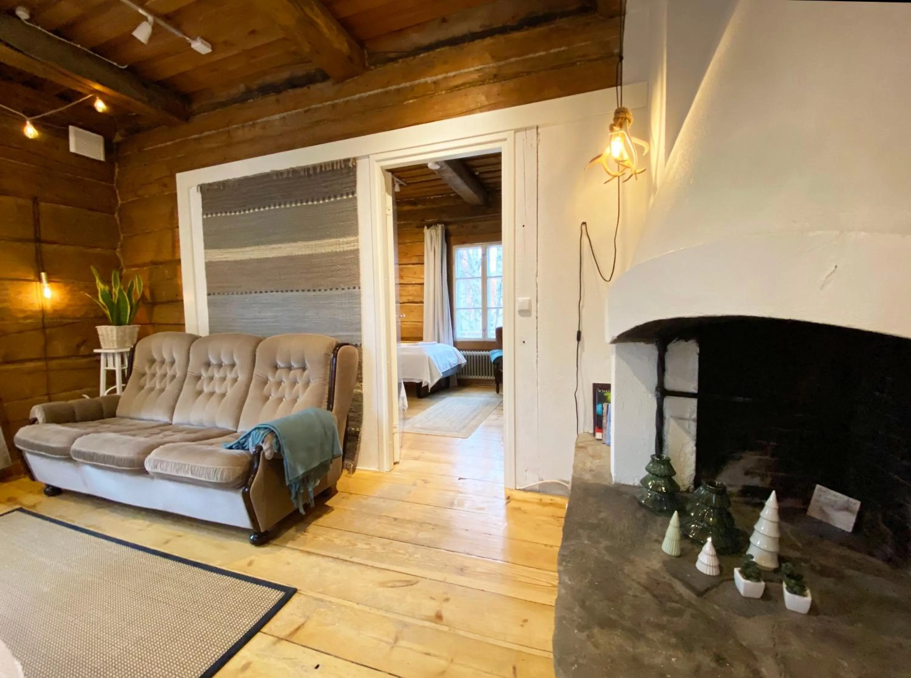 Seating area, Bed in LAURI Historical Log House Manor