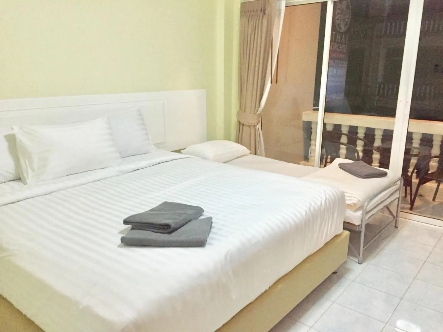 Bed in Thai Orchid Guest House