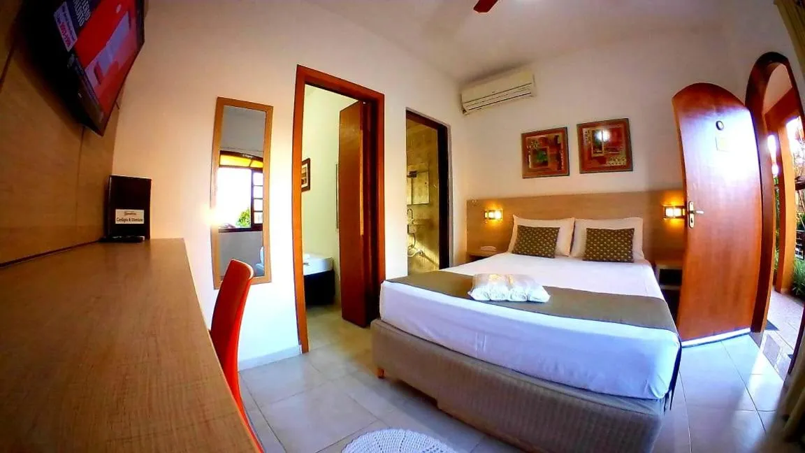 Bed in Hotel Pousada Paradise