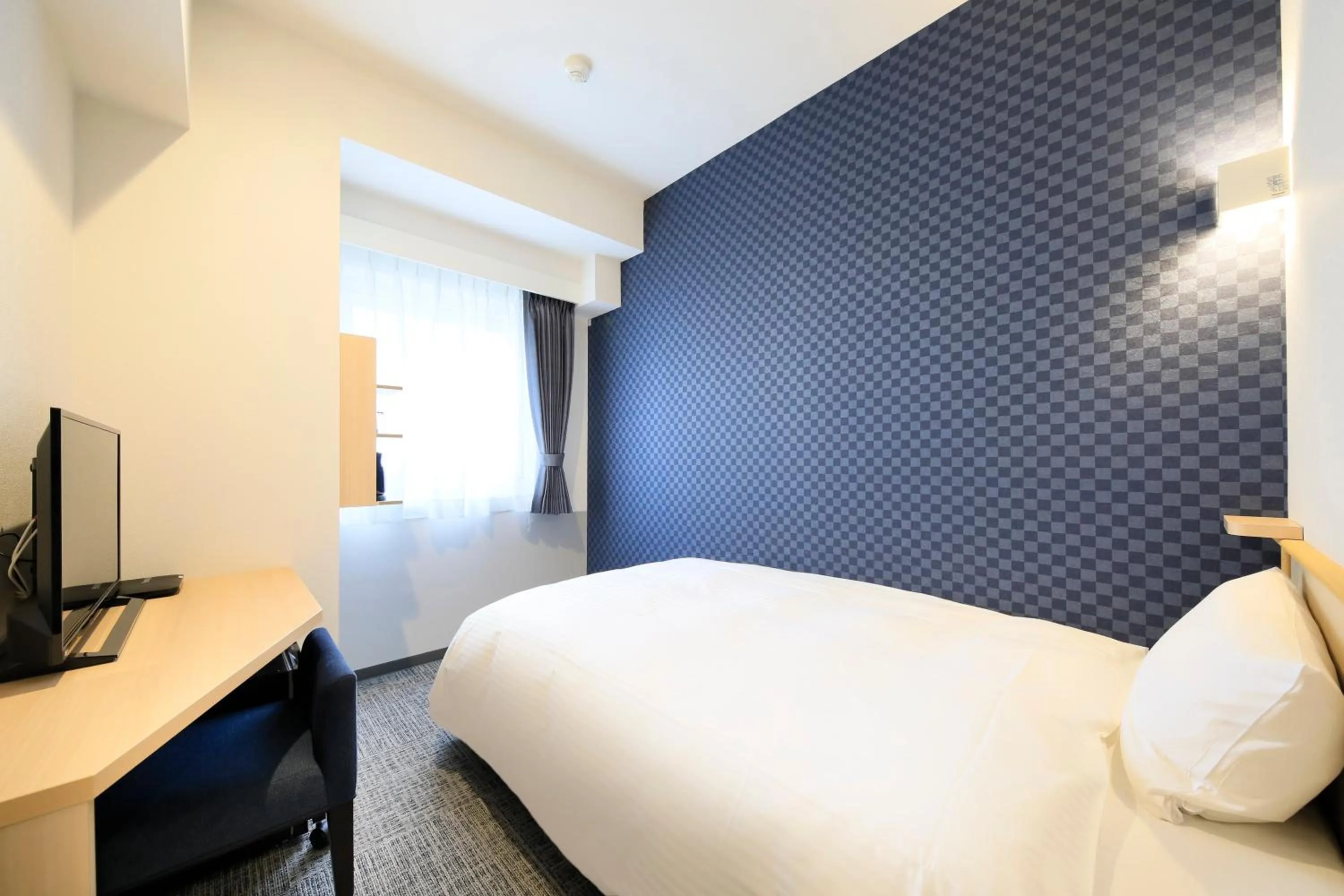 Bed in Hotel NewNagano NeXT