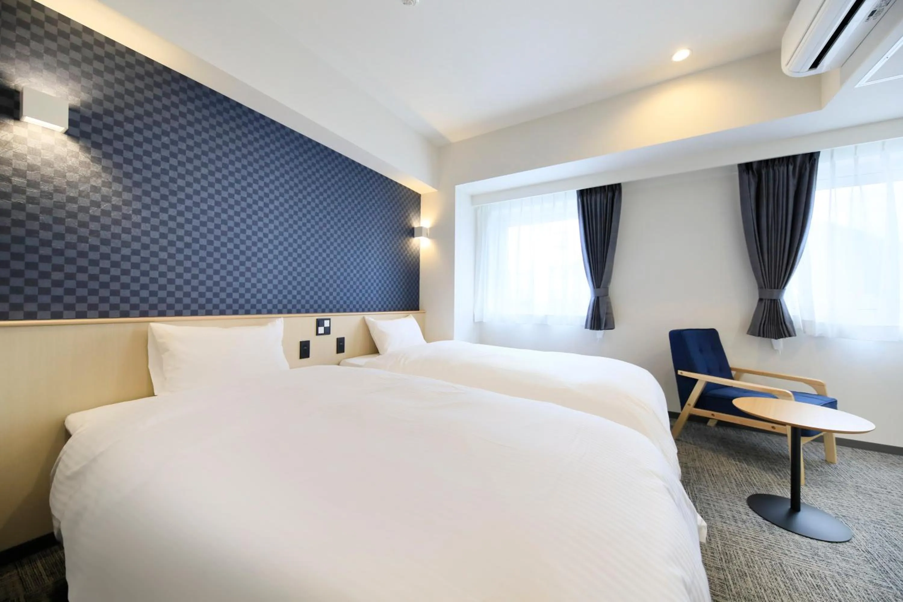 Bed in Hotel NewNagano NeXT