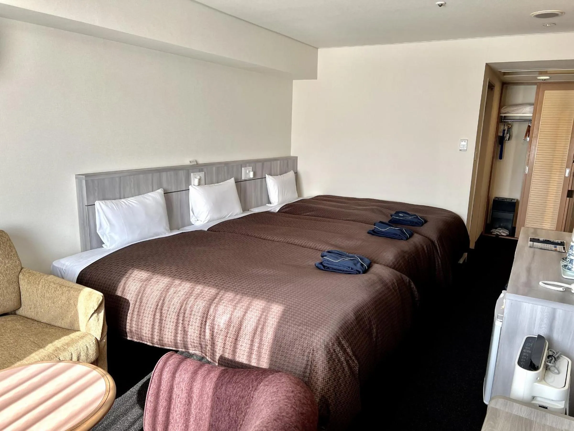 Bed in Sunwest Hotel Sasebo