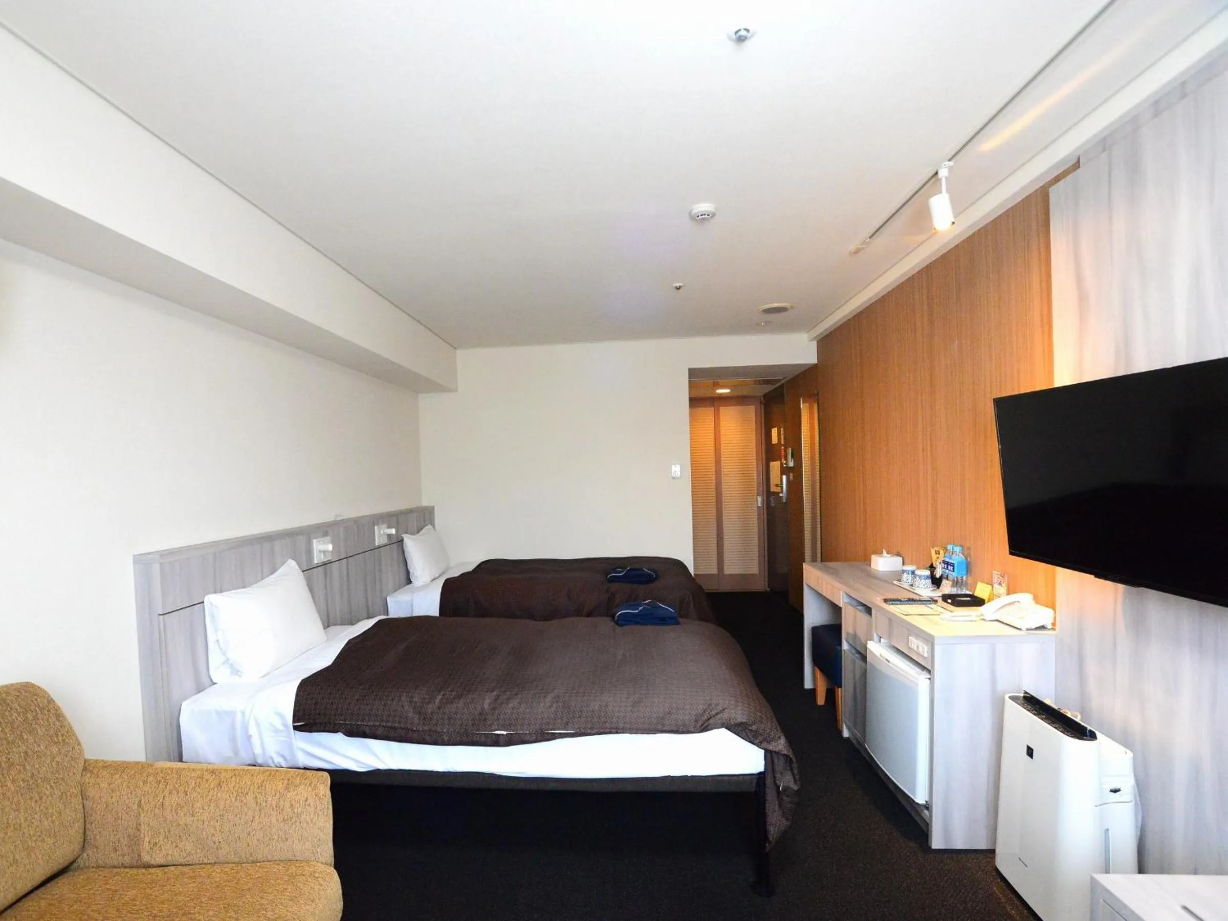 Bed in Sunwest Hotel Sasebo