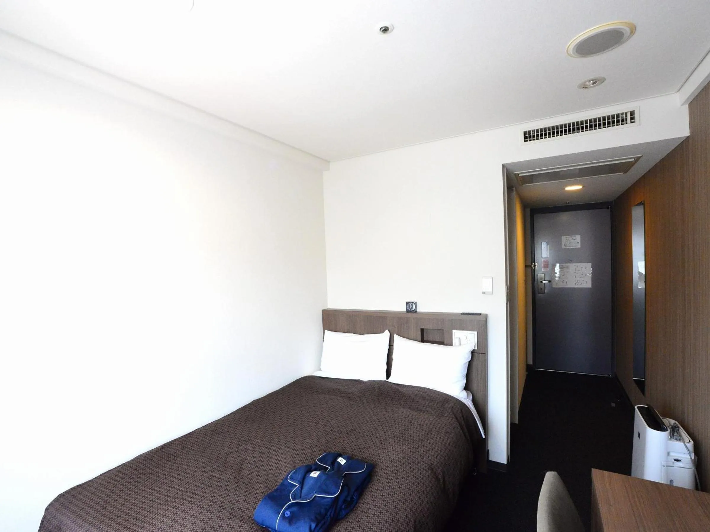 Bed in Sunwest Hotel Sasebo