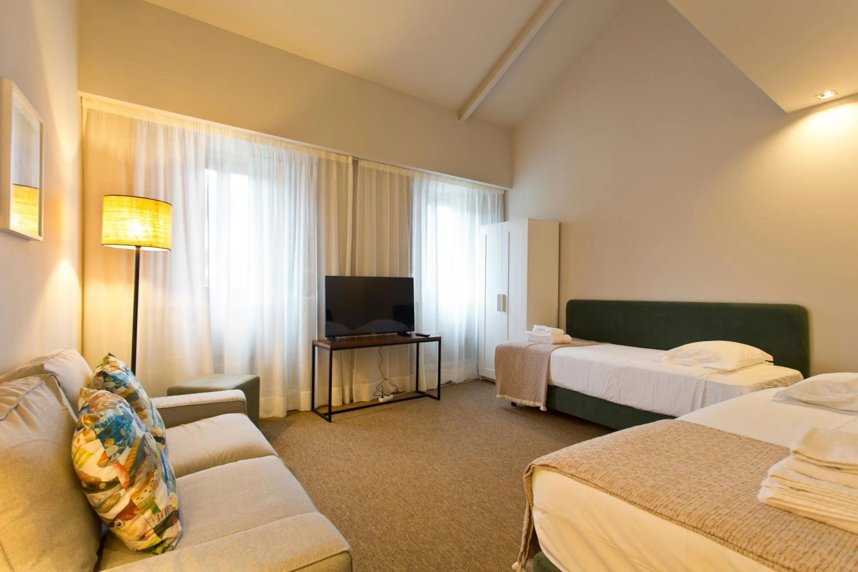 Living room, Bed in RVA - Gustave Eiffel Apartments