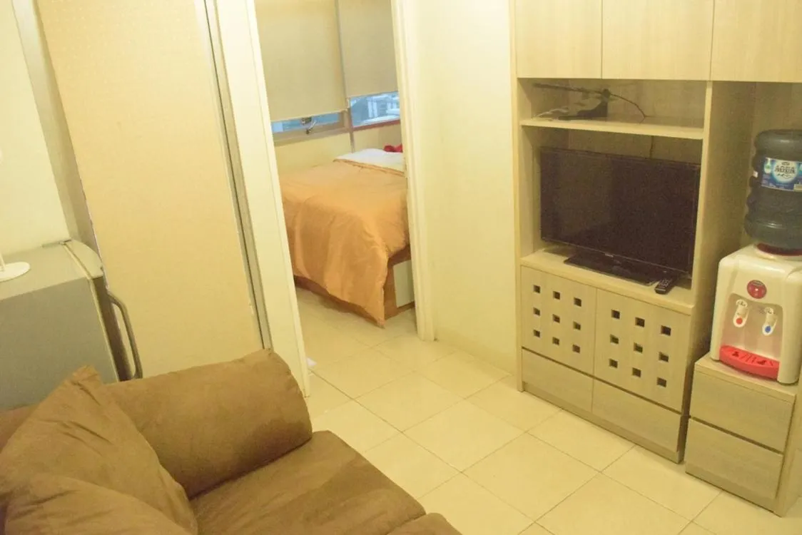 Living room, Bed in Pakubuwono Terrace Apartment